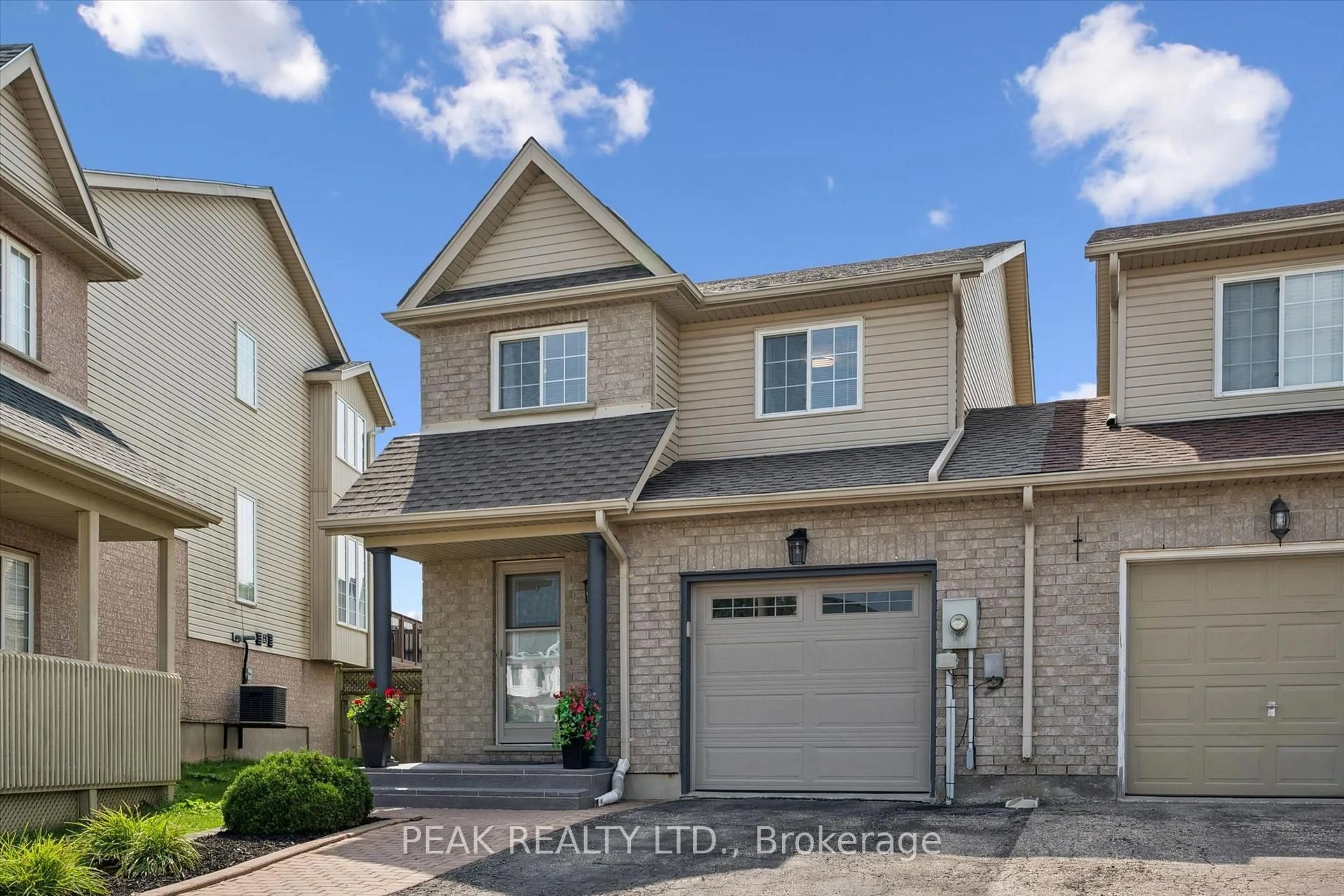 Home with brick exterior material, street for 166 Windflower Dr, Kitchener Ontario N2E 3T2