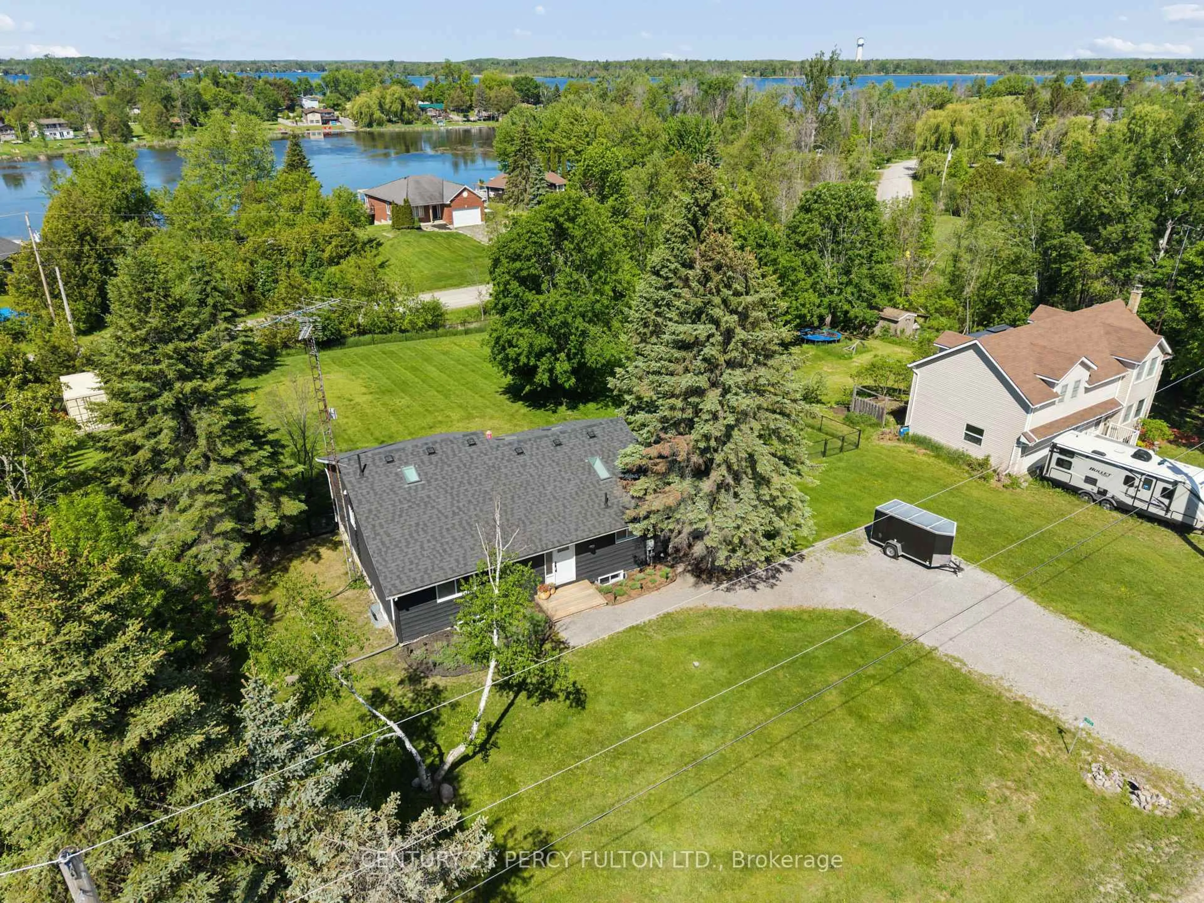 A pic from outside/outdoor area/front of a property/back of a property/a pic from drone, water/lake/river/ocean view for 1935 Pratt's Marina Rd, Selwyn Ontario K0L 2H0