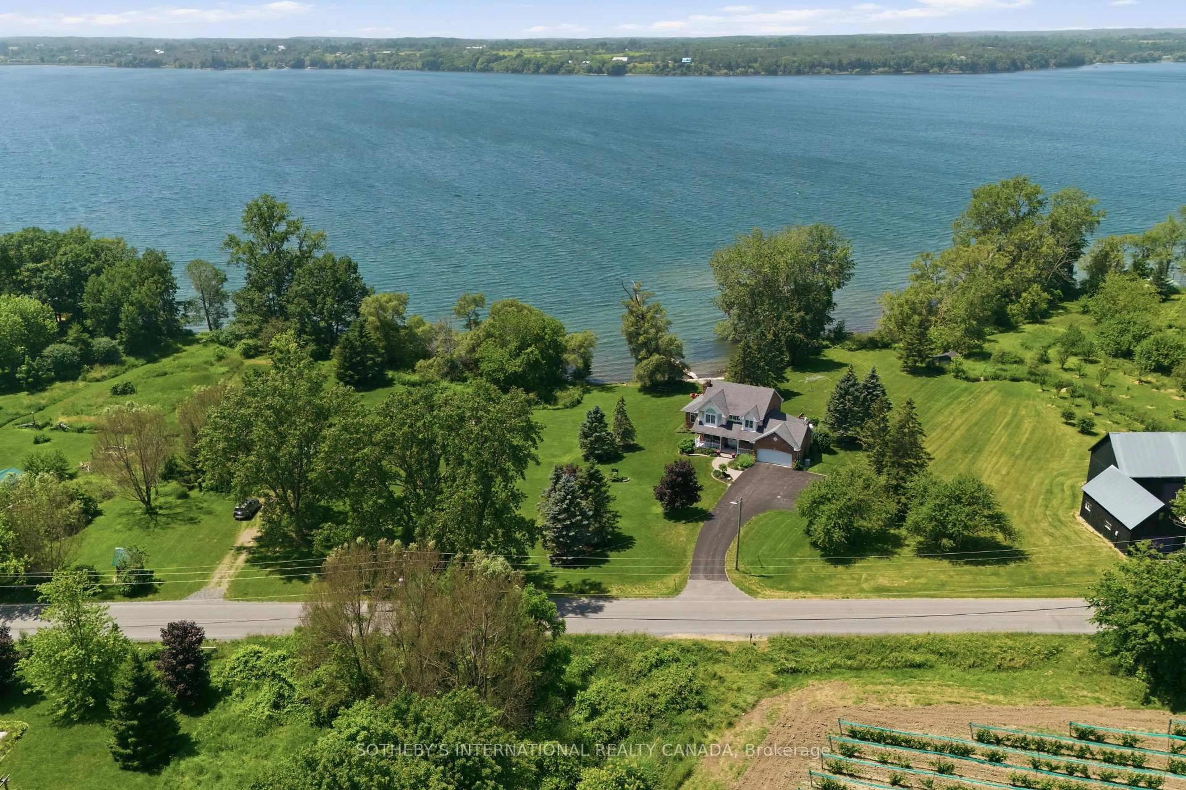 A pic from outside/outdoor area/front of a property/back of a property/a pic from drone, water/lake/river/ocean view for 3007 County Road 13, Prince Edward County Ontario K0K 2P0