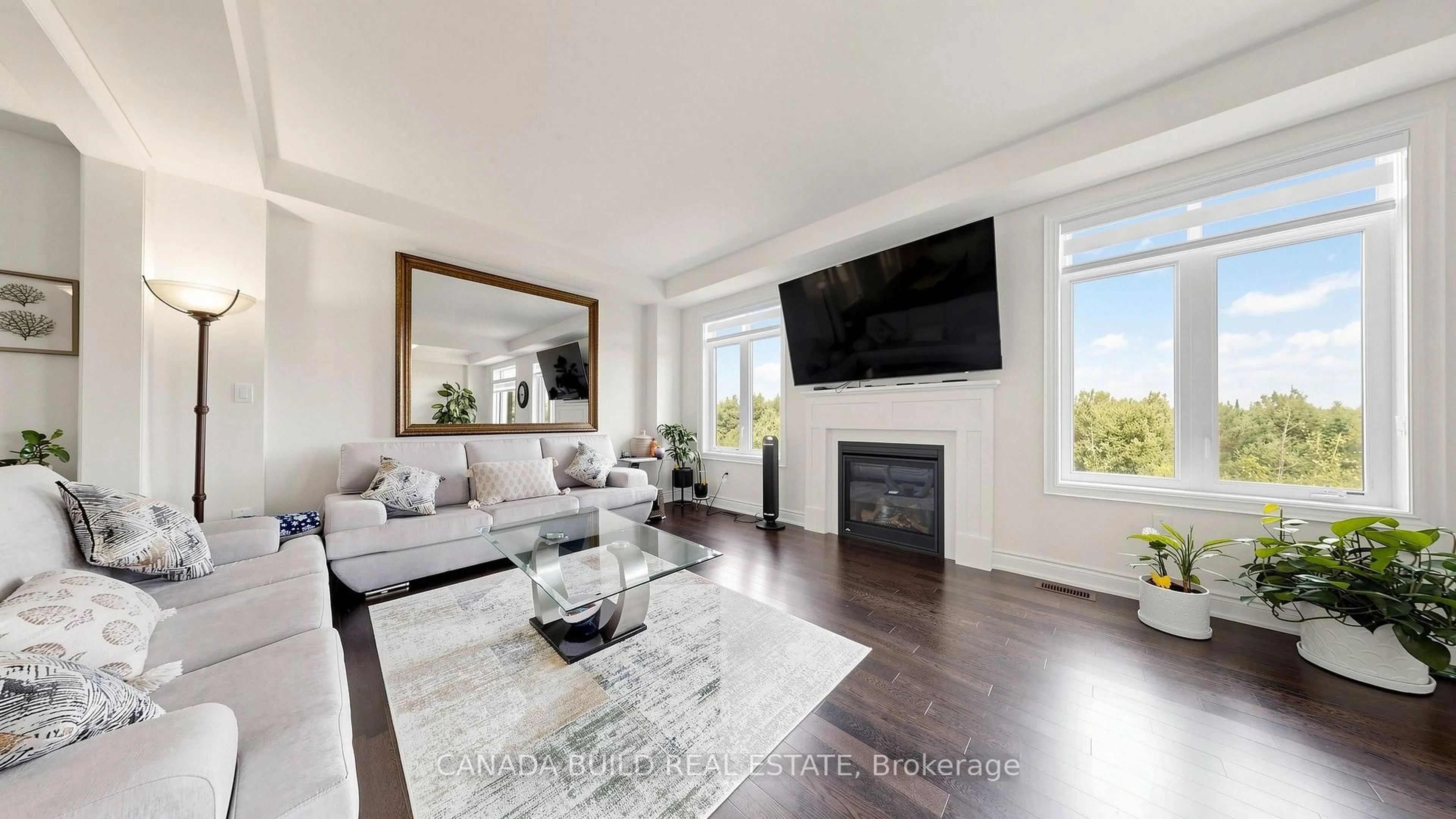Living room with furniture, wood/laminate floor for 104 Henshaw Dr, Erin Ontario N0B 1T0