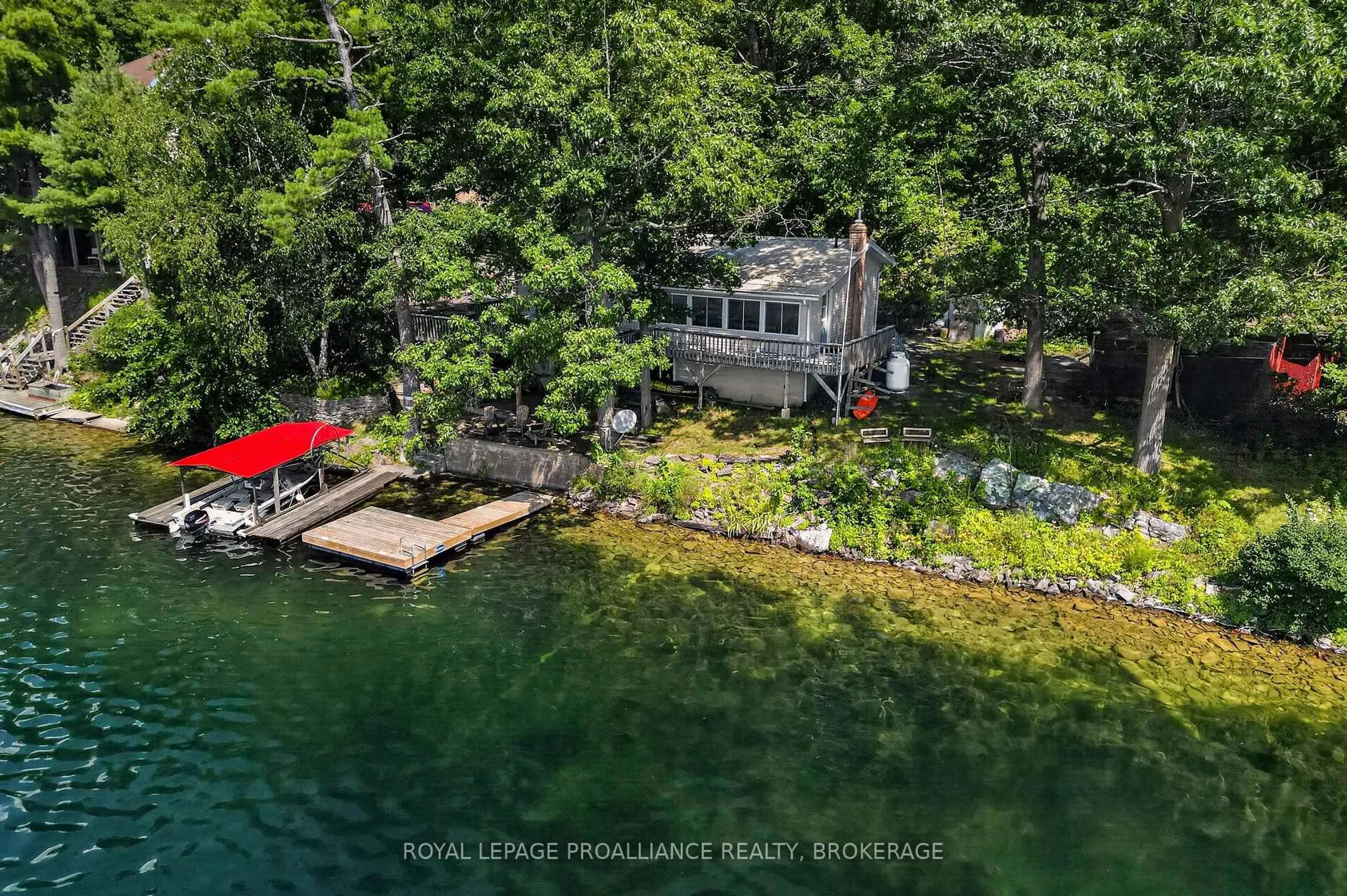 A pic from outside/outdoor area/front of a property/back of a property/a pic from drone, water/lake/river/ocean view for 1403B Everett Lane, Sydenham Ontario K0H 2T0