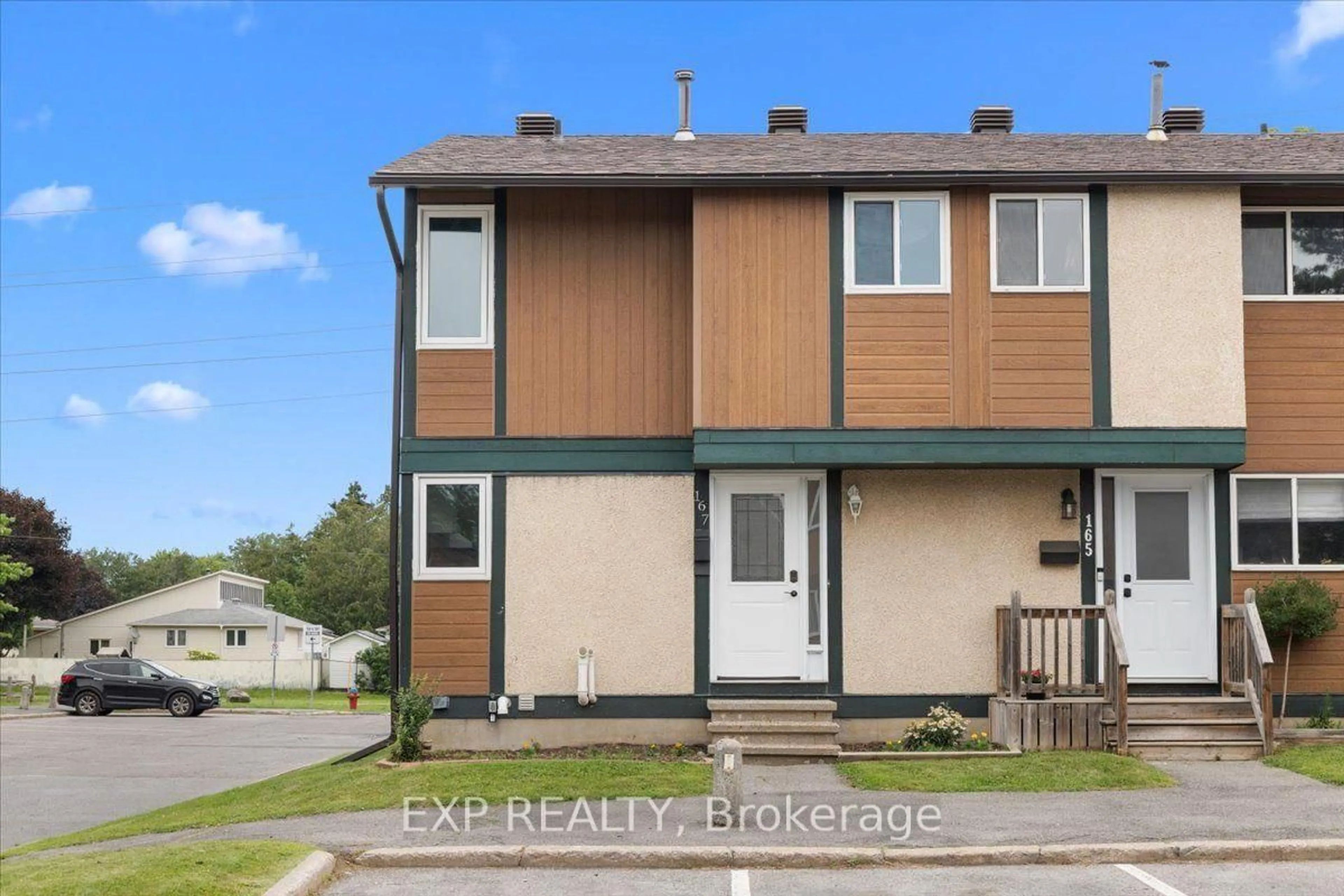 Home with vinyl exterior material, street for 1449 Ridgebrook Dr #167, Ottawa Ontario K1B 4T1