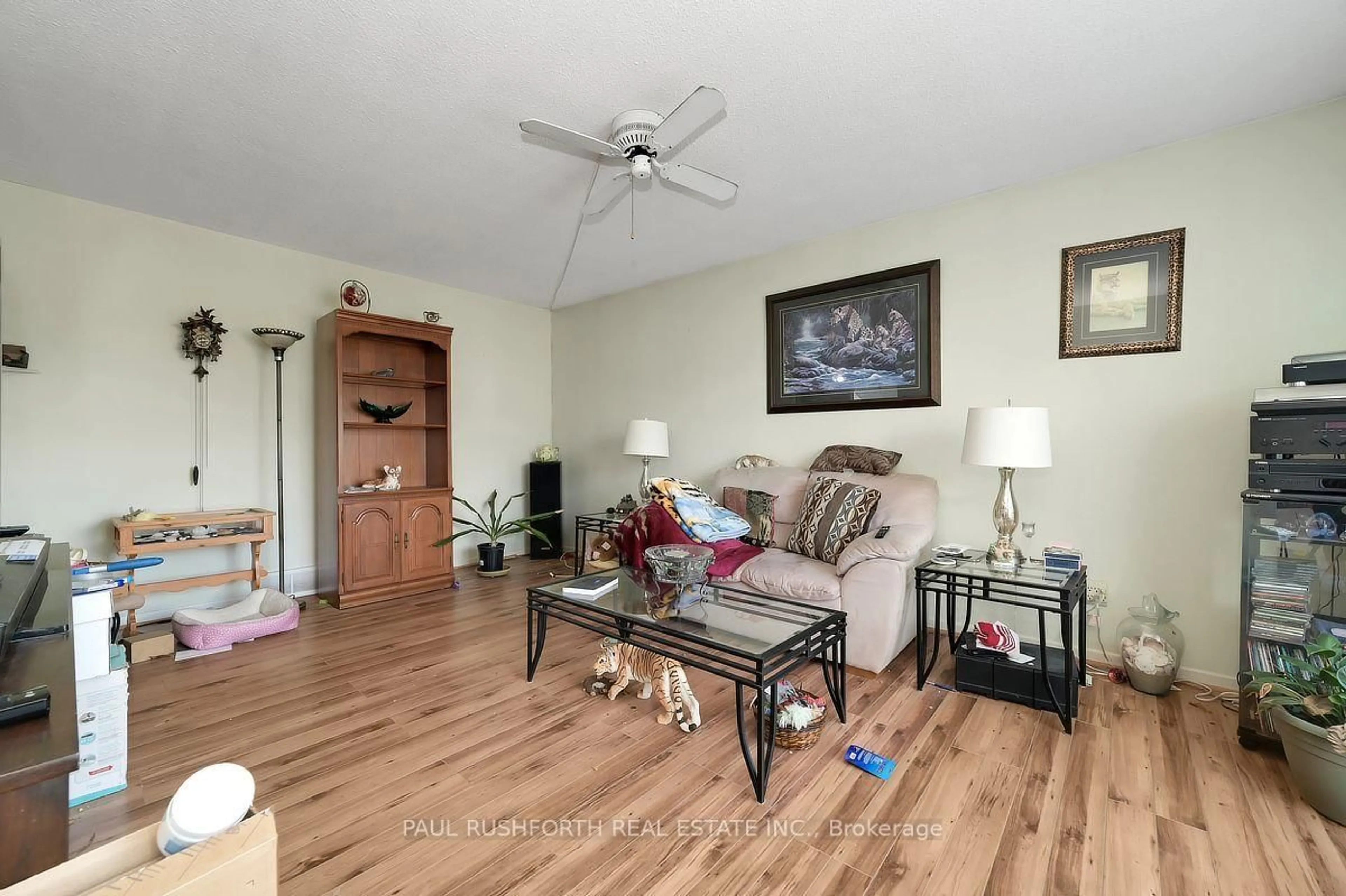 Living room with furniture, wood/laminate floor for 2087 Boyer Rd, Orleans Ontario K1C 1R5
