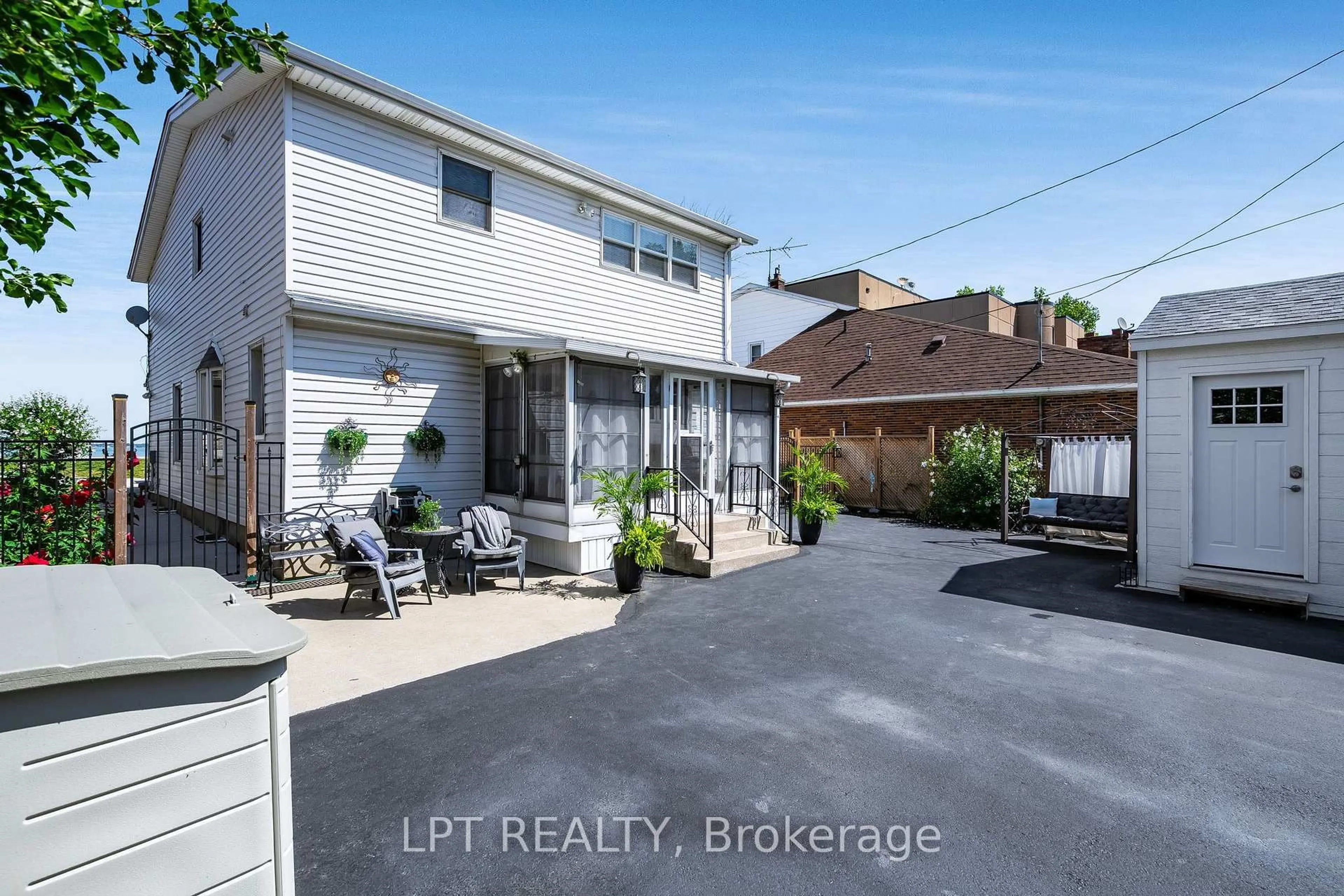 A pic from outside/outdoor area/front of a property/back of a property/a pic from drone, street for 12086 Riverside Dr, Tecumseh Ontario N8P 1A9