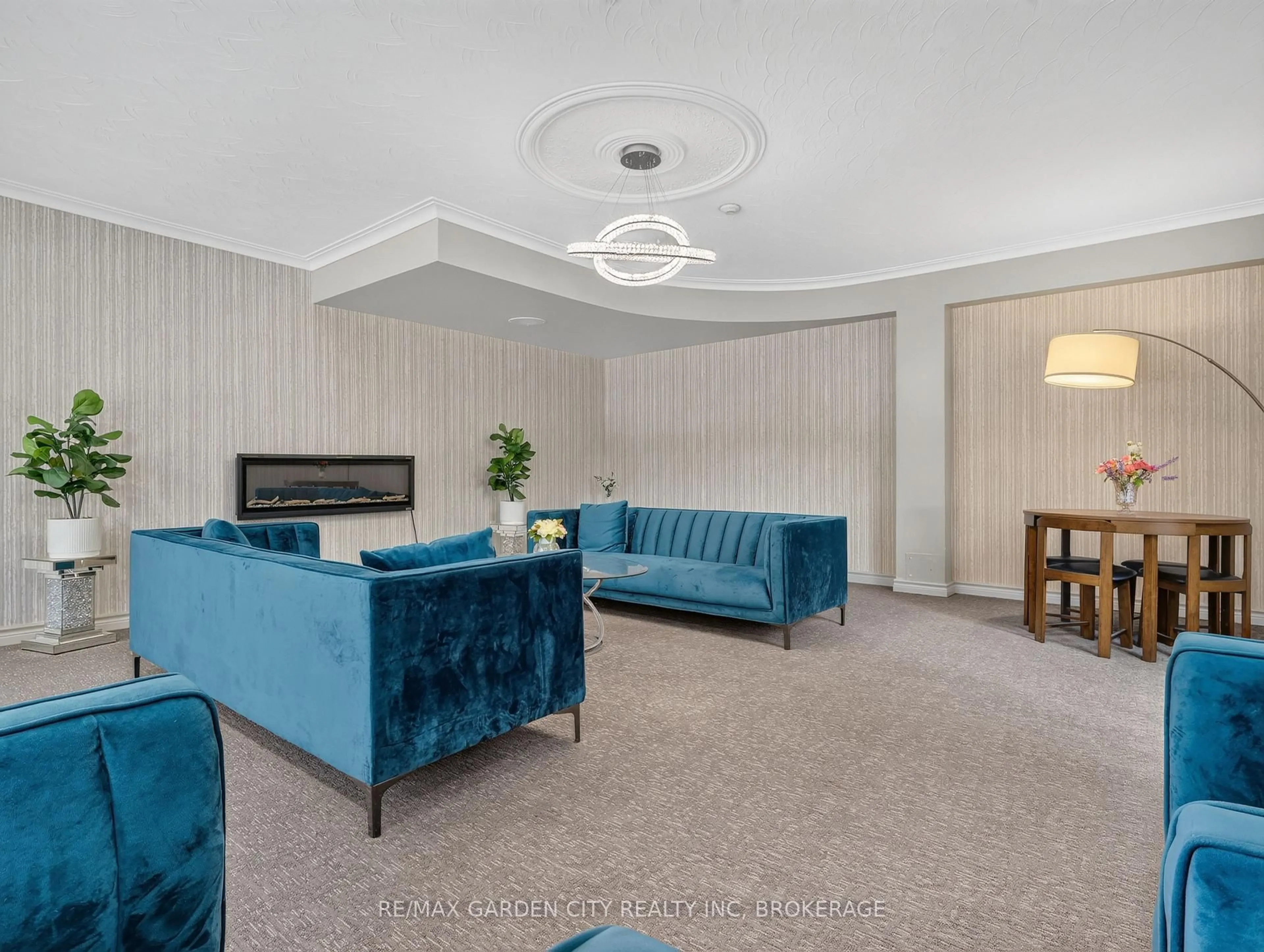 Living room with furniture, carpet floor for 359 Geneva St #701, St. Catharines Ontario L2N 2G5