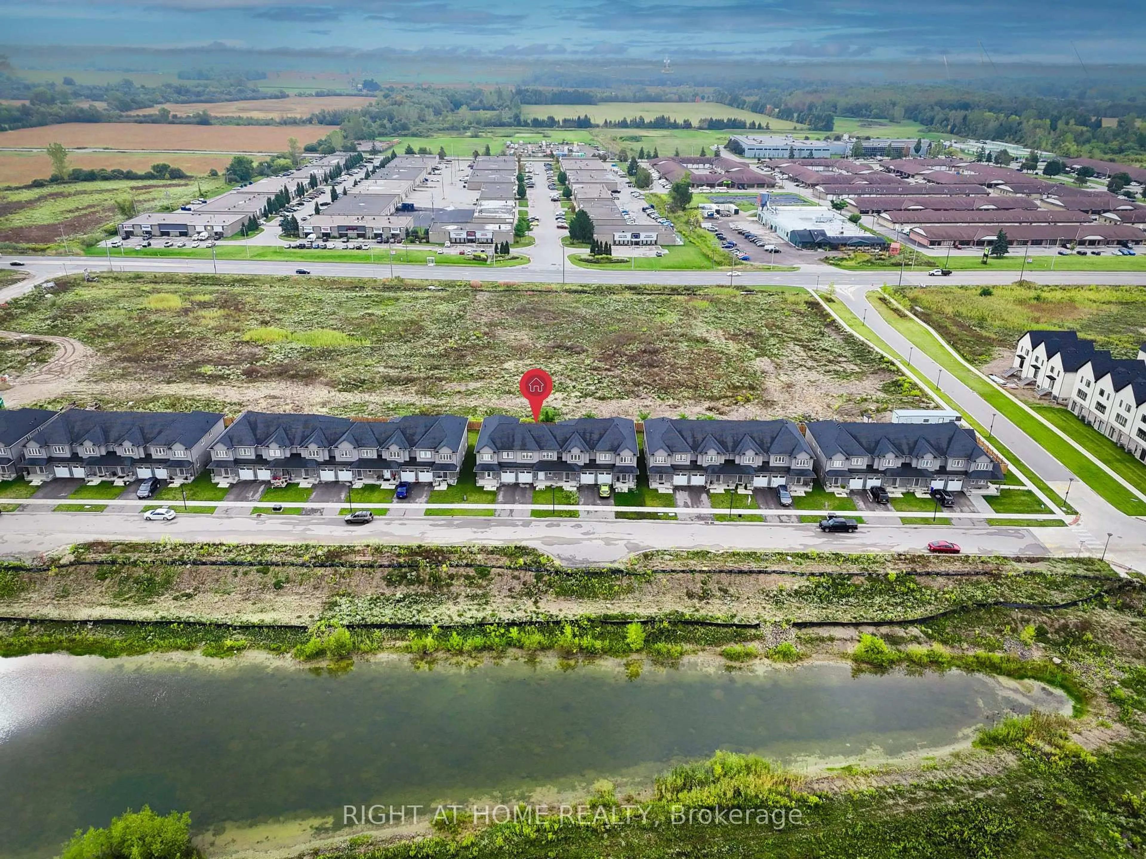 A pic from outside/outdoor area/front of a property/back of a property/a pic from drone, water/lake/river/ocean view for 307 Kennington Way, London South Ontario N6L 0H4