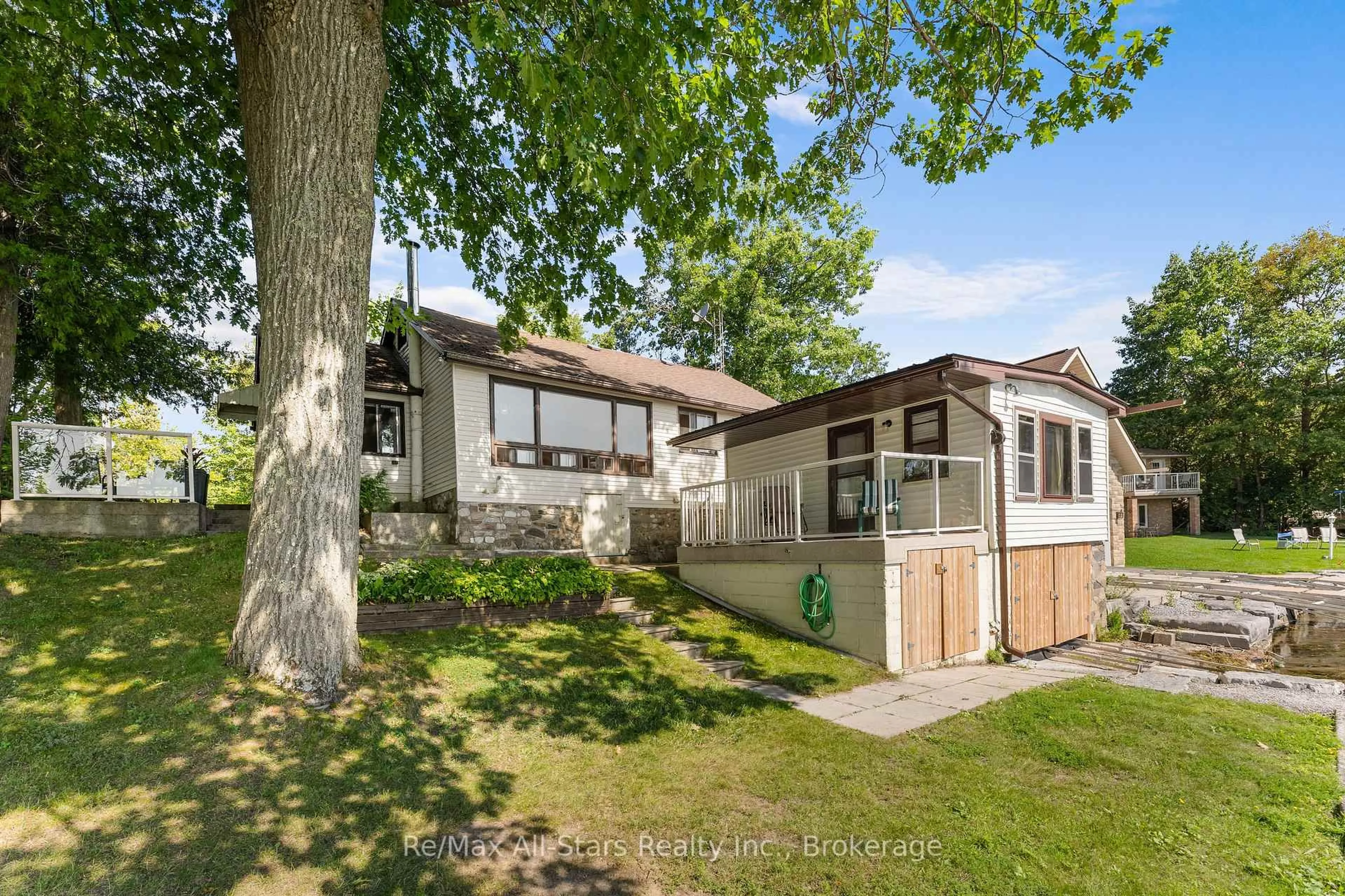 Home with vinyl exterior material, street for 75 Fells Point Rd, Kawartha Lakes Ontario K0M 1N0