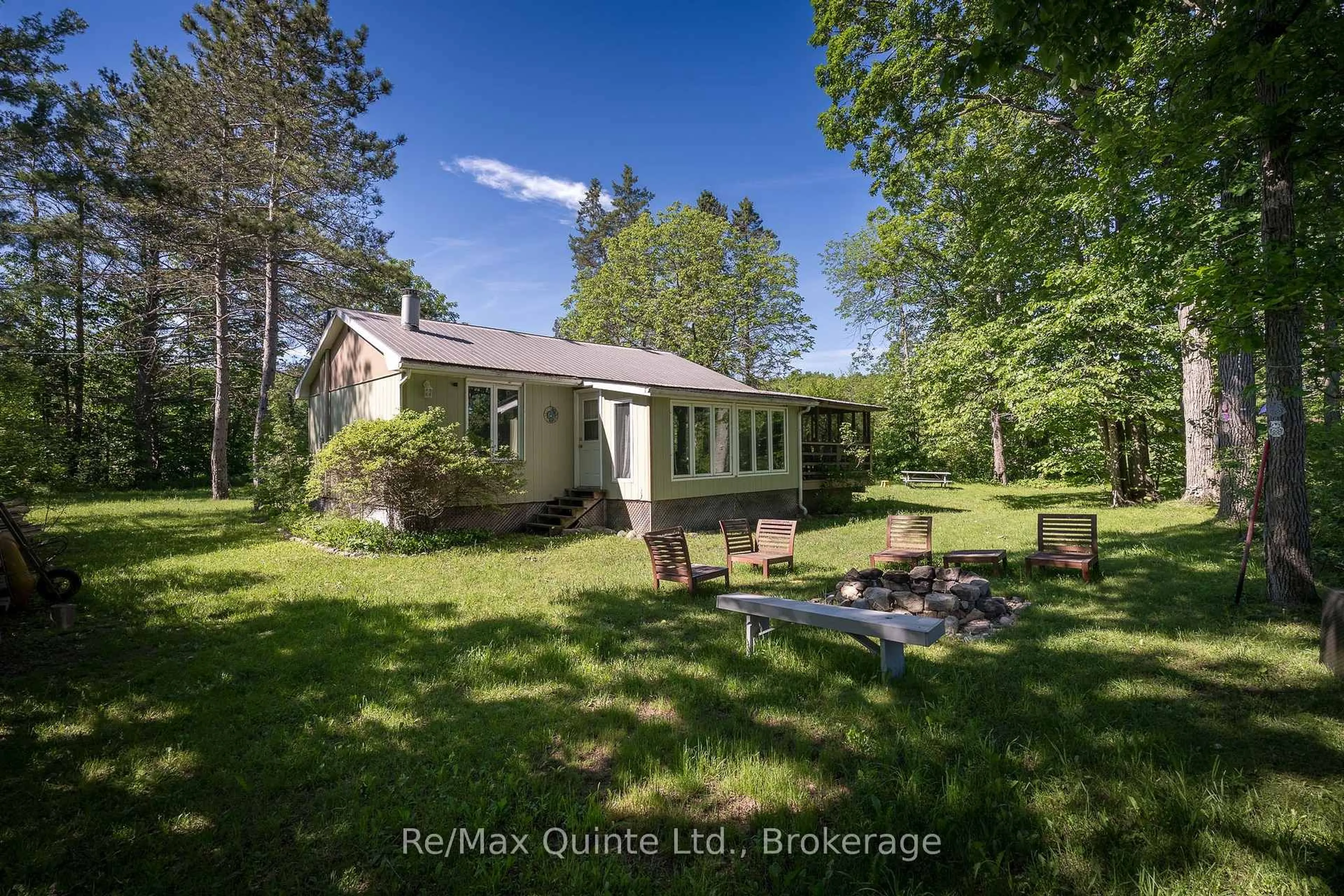 A pic from outside/outdoor area/front of a property/back of a property/a pic from drone, water/lake/river/ocean view for 74 French Settlement Lane, Tweed Ontario K0K 3J0