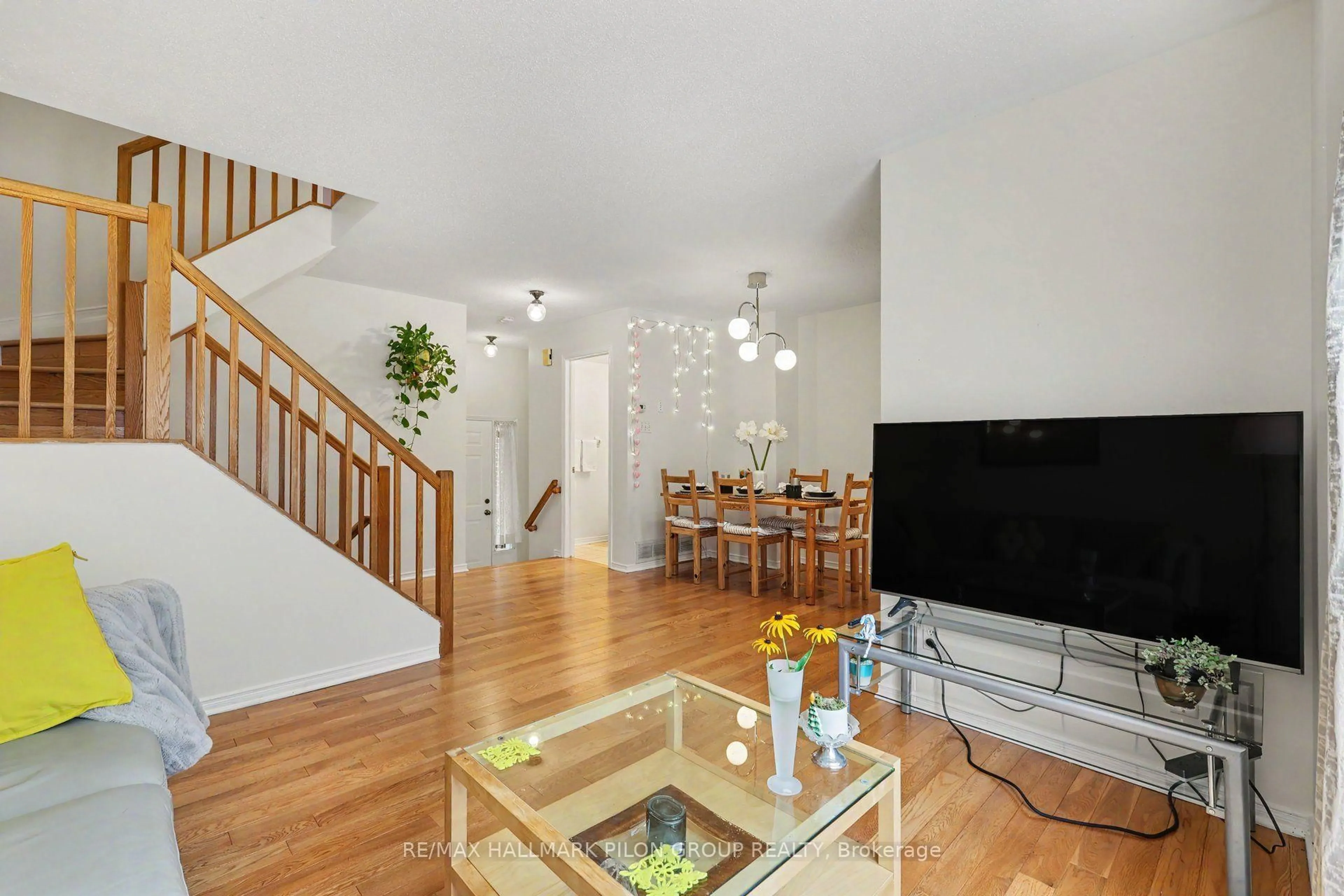 Living room with furniture, wood/laminate floor for 48 Jackman Terr, Ottawa Ontario K2L 4E1