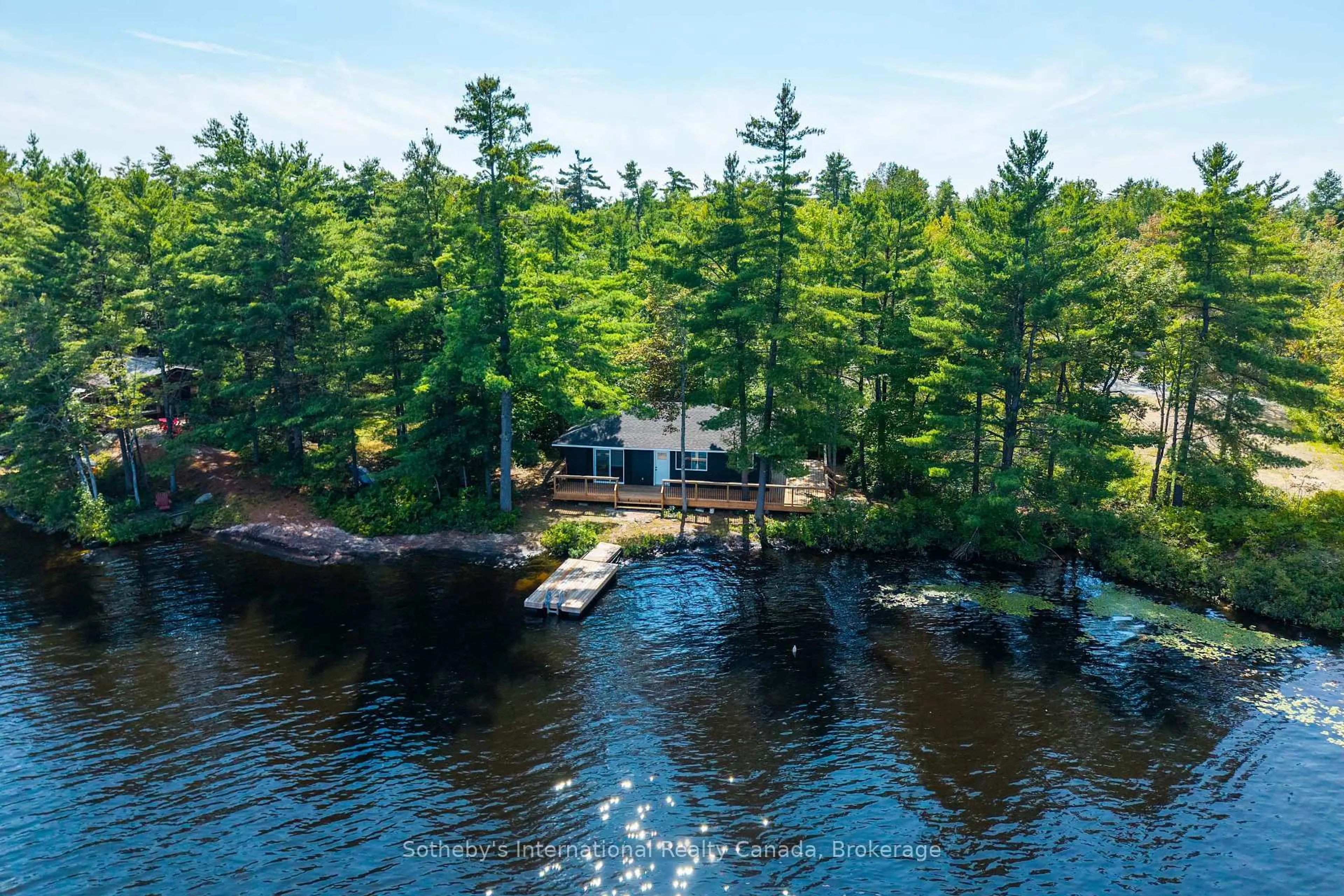 A pic from outside/outdoor area/front of a property/back of a property/a pic from drone, water/lake/river/ocean view for 1055 West Bank Dr #COTTAGE, Gravenhurst Ontario P0E 1G0
