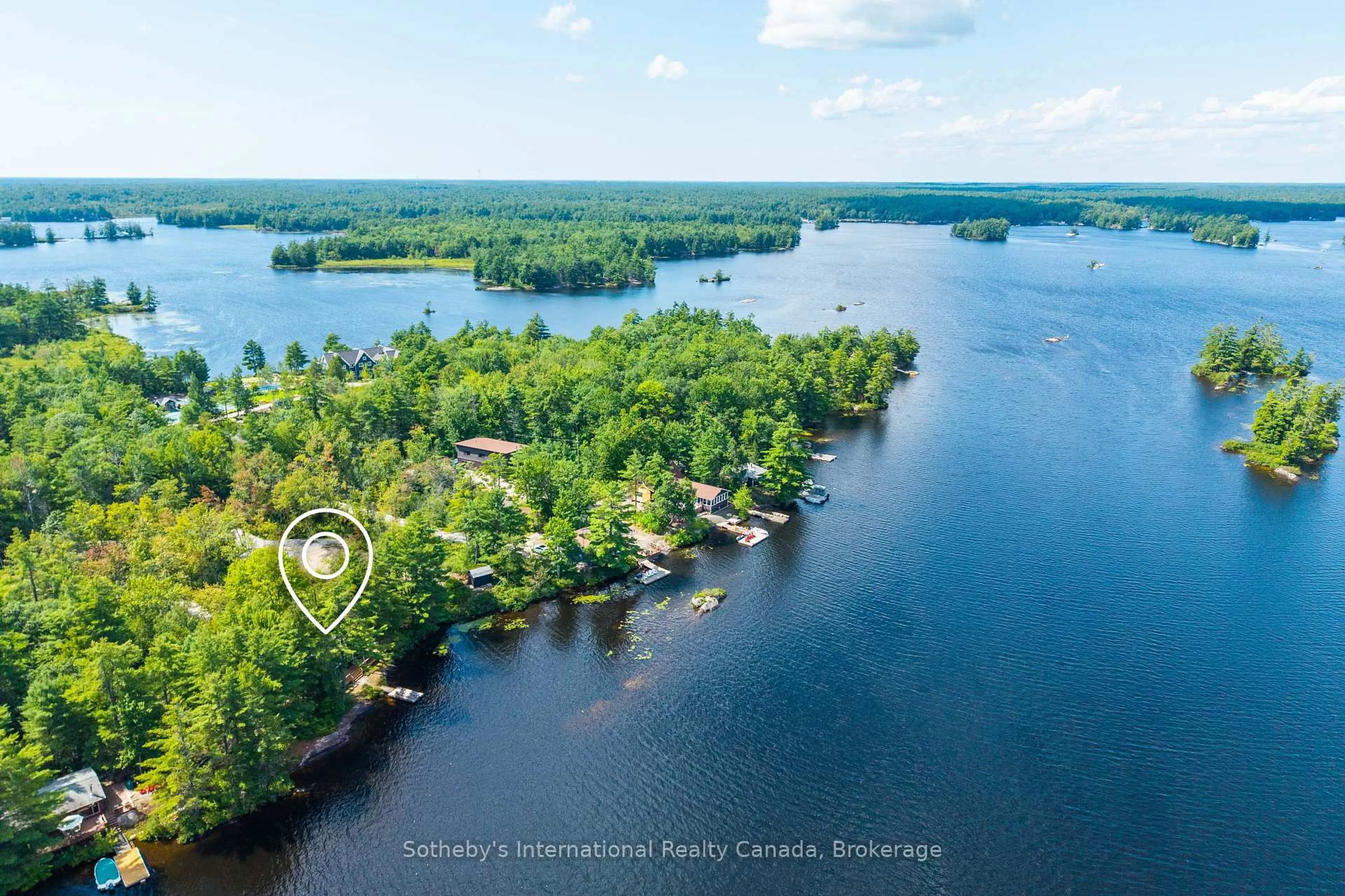 A pic from outside/outdoor area/front of a property/back of a property/a pic from drone, water/lake/river/ocean view for 1055 West Bank Dr #COTTAGE, Gravenhurst Ontario P0E 1G0