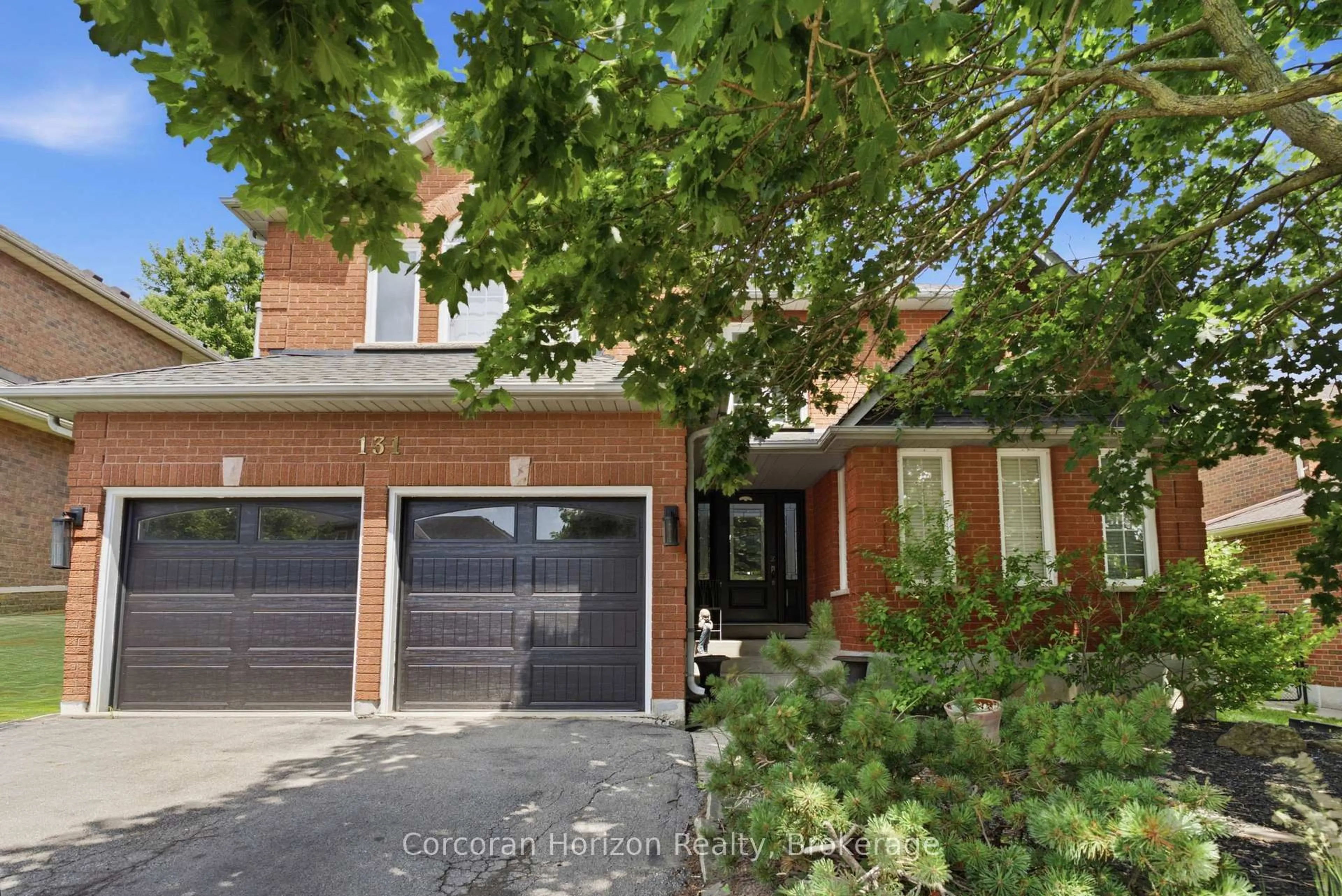 Home with brick exterior material, street for 131 Huntingwood Ave, Hamilton Ontario L9H 6X5