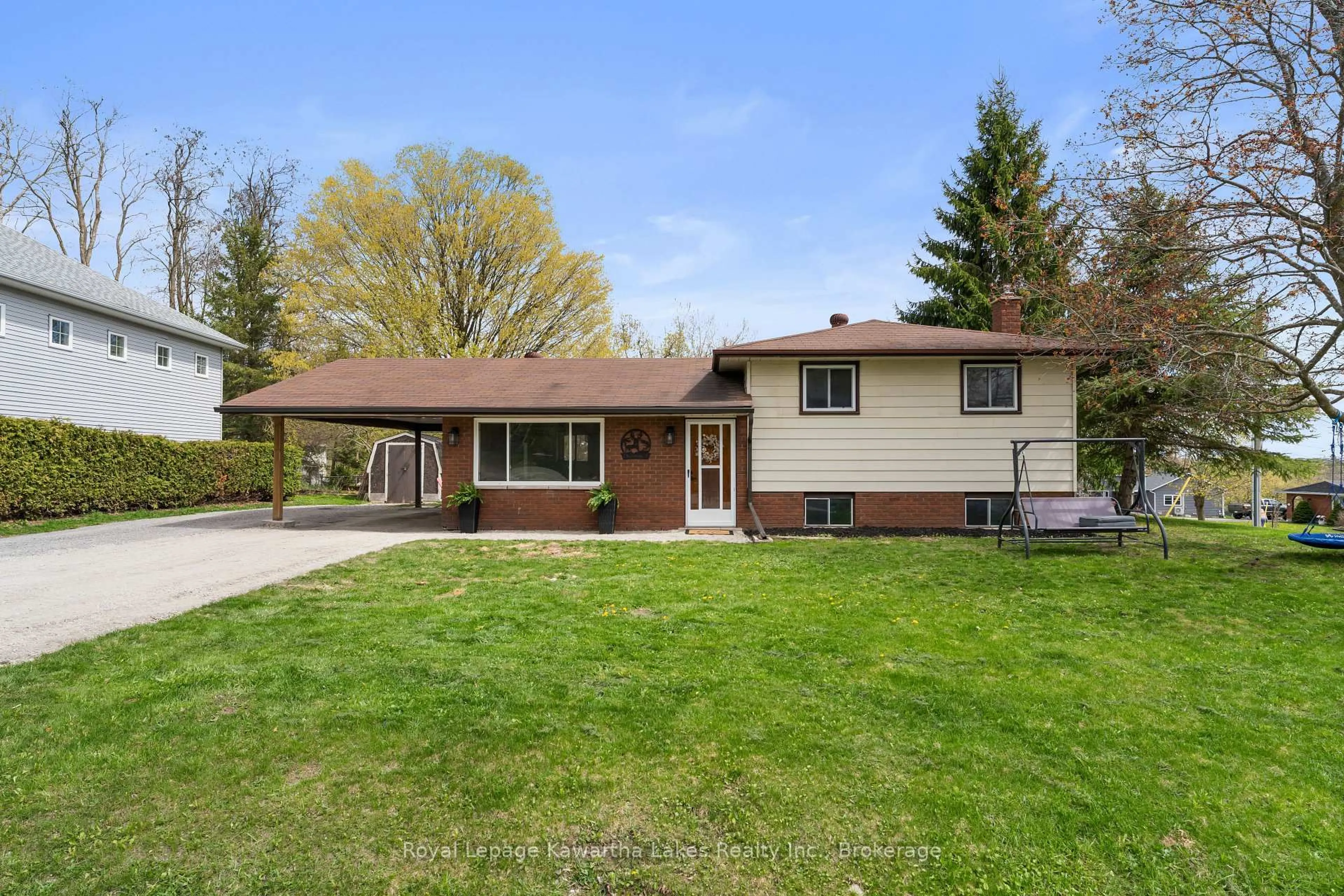 Home with vinyl exterior material, street for 2 Kennedy Dr, Kawartha Lakes Ontario K0M 1N0