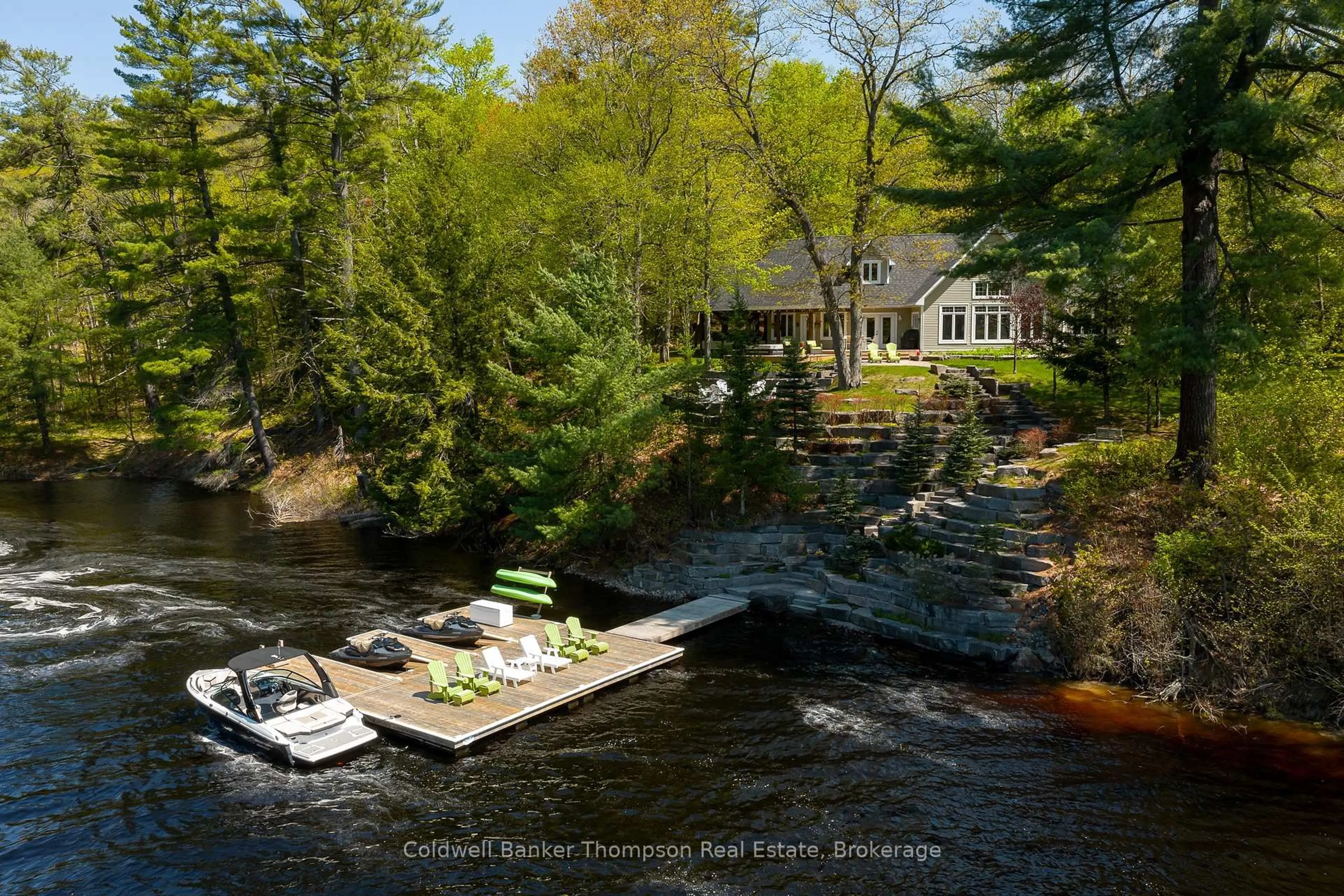 A pic from outside/outdoor area/front of a property/back of a property/a pic from drone, water/lake/river/ocean view for 54 Hoodstown Shores Rd, Huntsville Ontario P1H 2J2