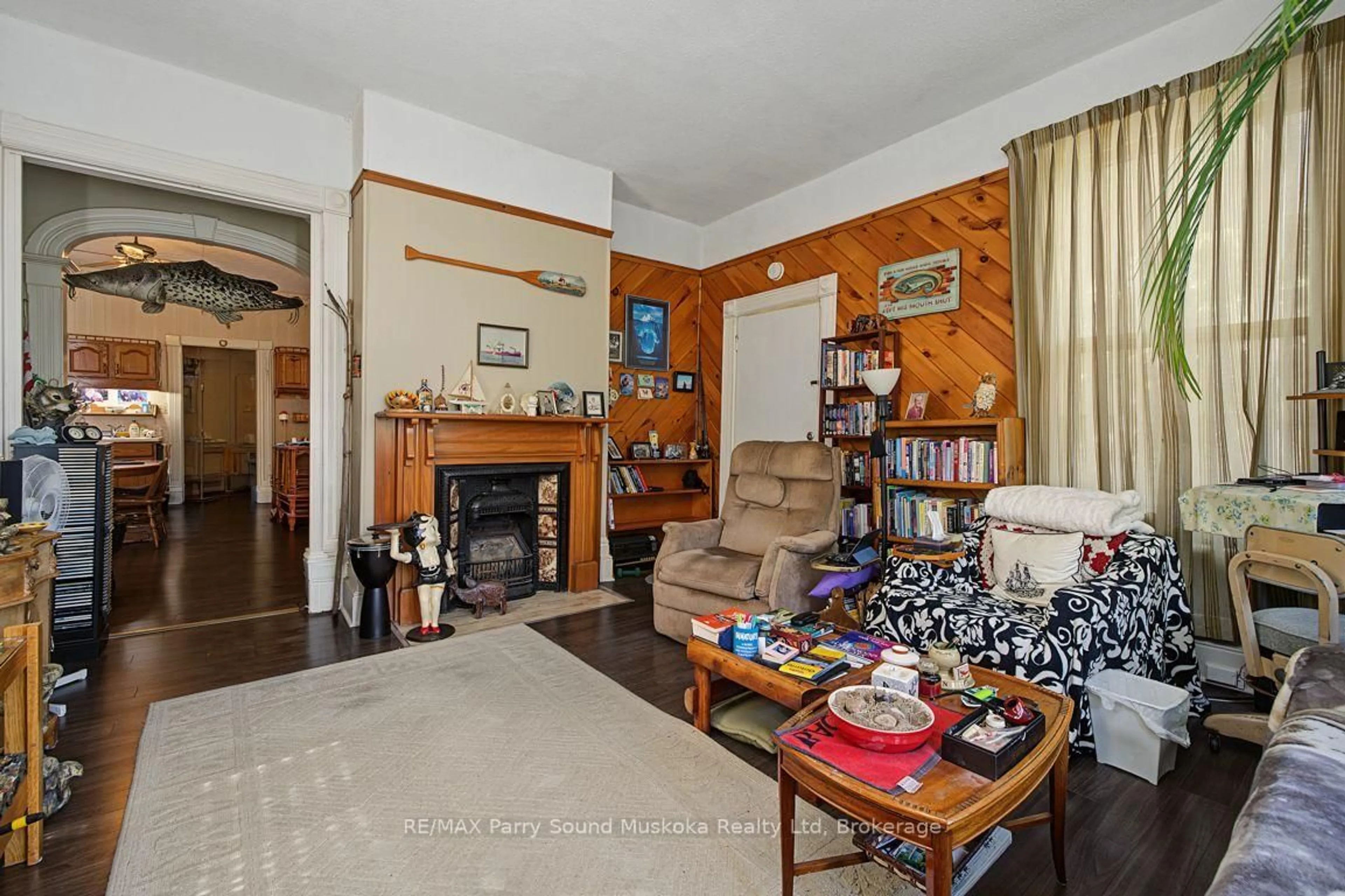 Living room with furniture, wood/laminate floor for 46 Church St, Parry Sound Ontario P2A 1Y5