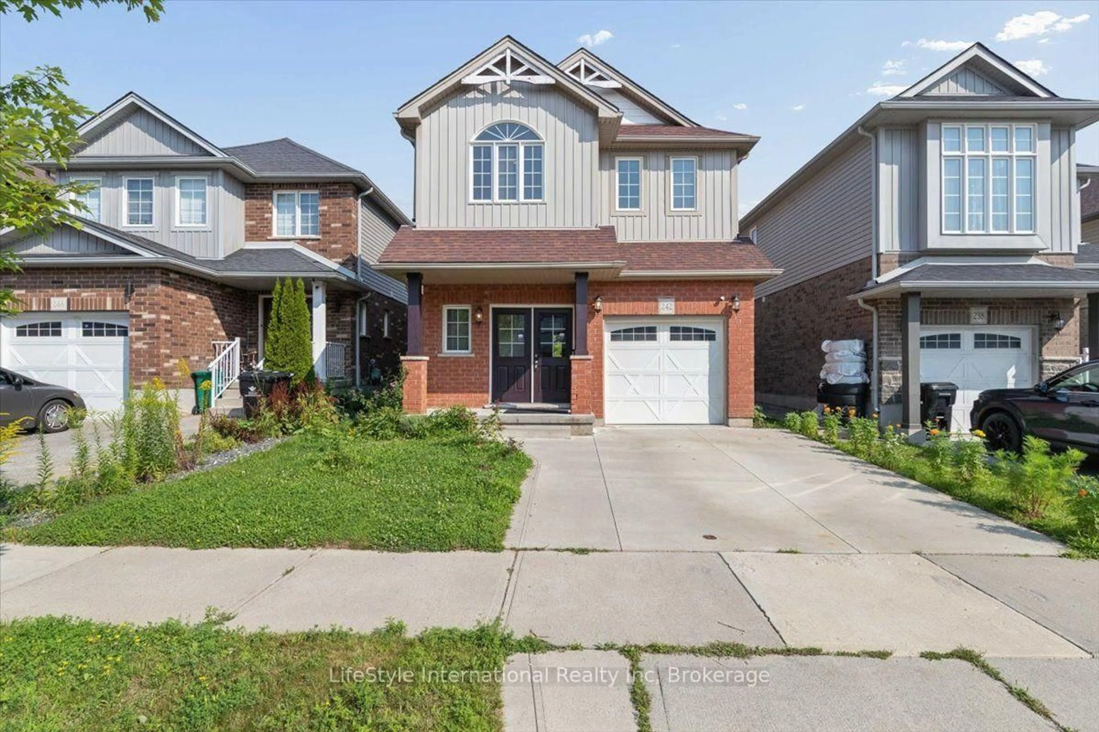 Home with brick exterior material, street for 242 Moorlands Cres, Kitchener Ontario N2P 0C4