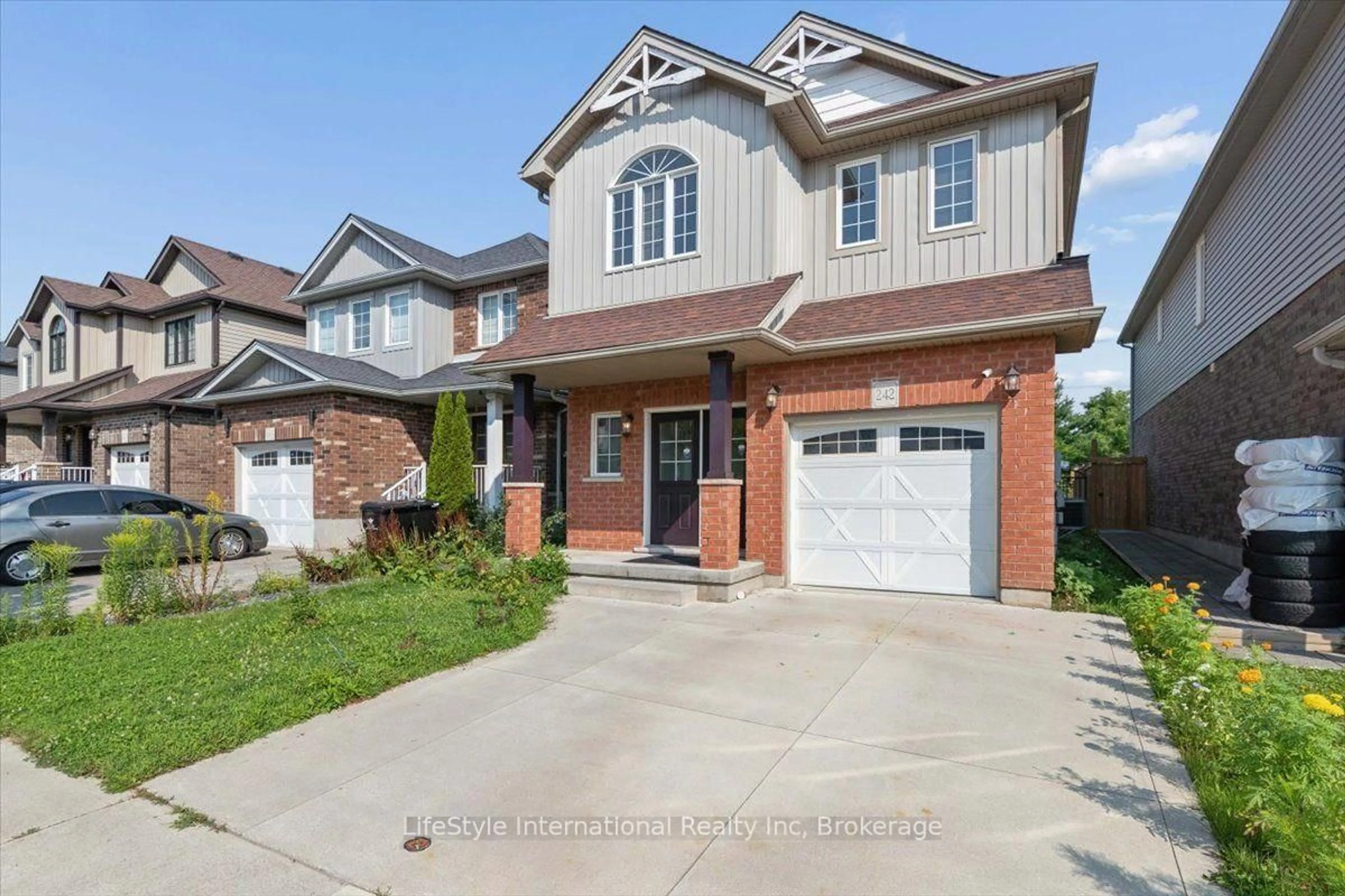 Home with brick exterior material, street for 242 Moorlands Cres, Kitchener Ontario N2P 0C4