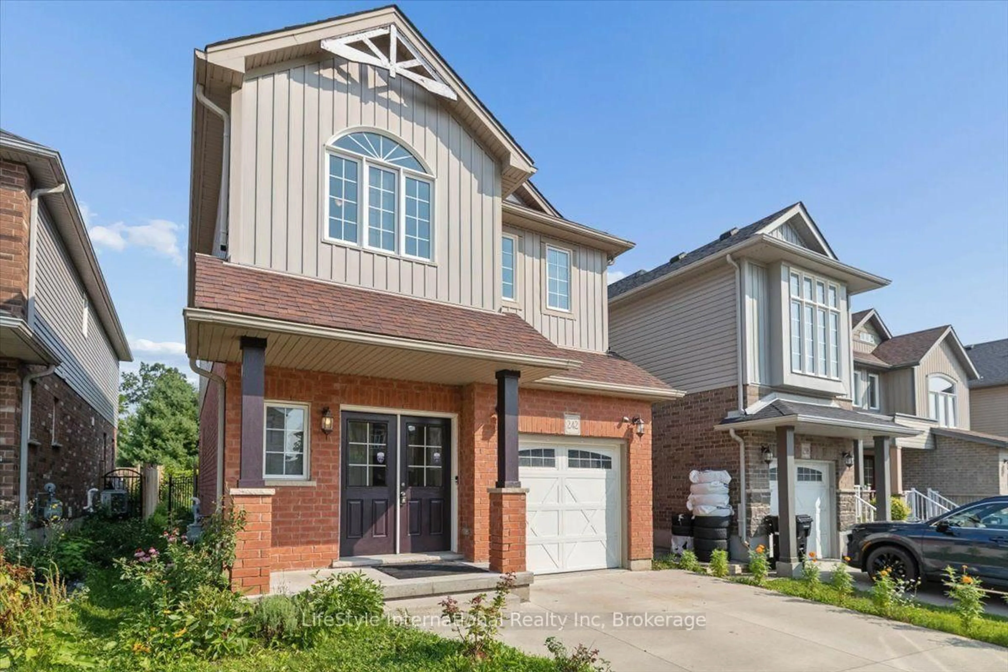 Home with brick exterior material, street for 242 Moorlands Cres, Kitchener Ontario N2P 0C4