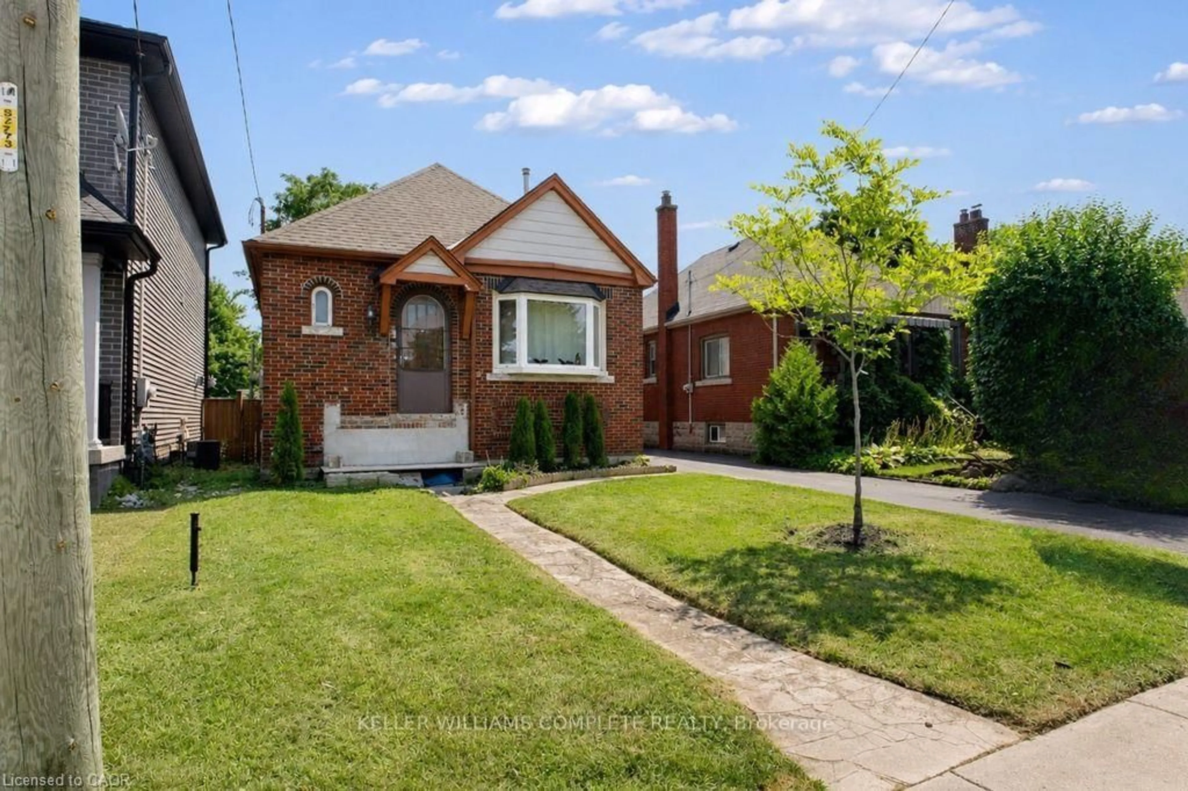 Home with brick exterior material, street for 35 Barons Ave, Hamilton Ontario L8K 2Y1