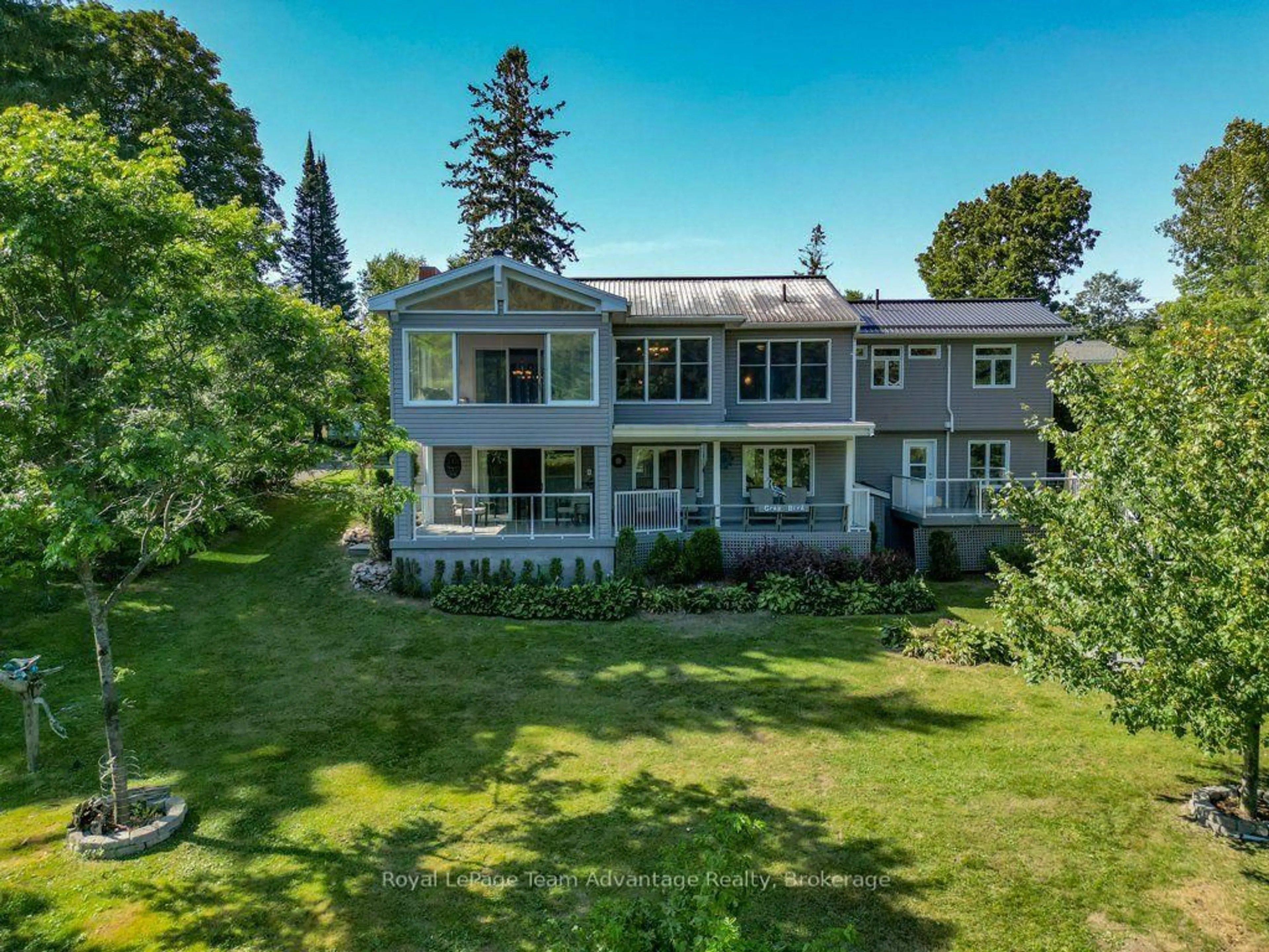 A pic from outside/outdoor area/front of a property/back of a property/a pic from drone, water/lake/river/ocean view for 6 Ginnie St, Parry Sound Ontario P2A 1L1