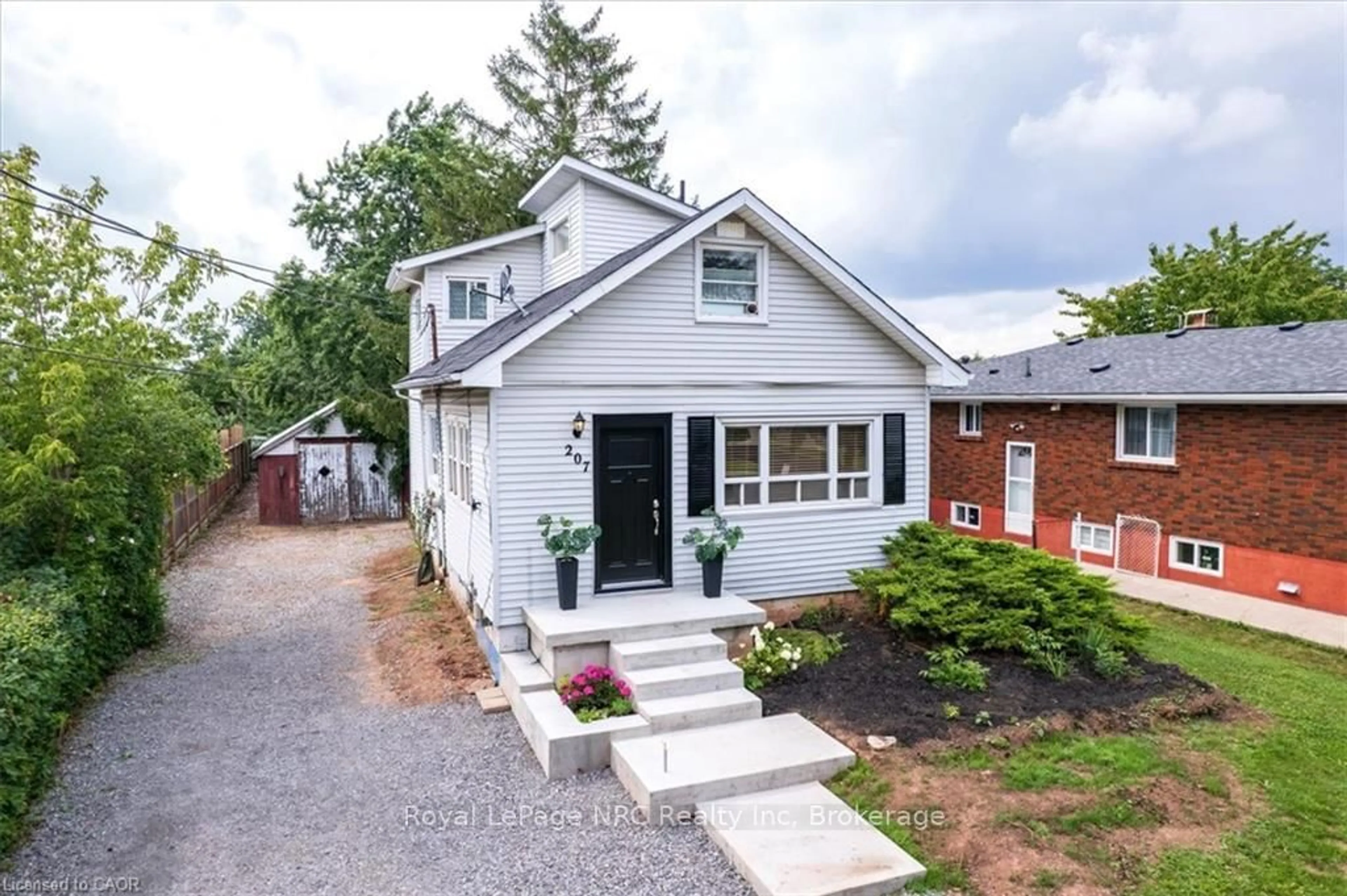 Home with brick exterior material, street for 207 Green Rd, Hamilton Ontario L8E 2A4