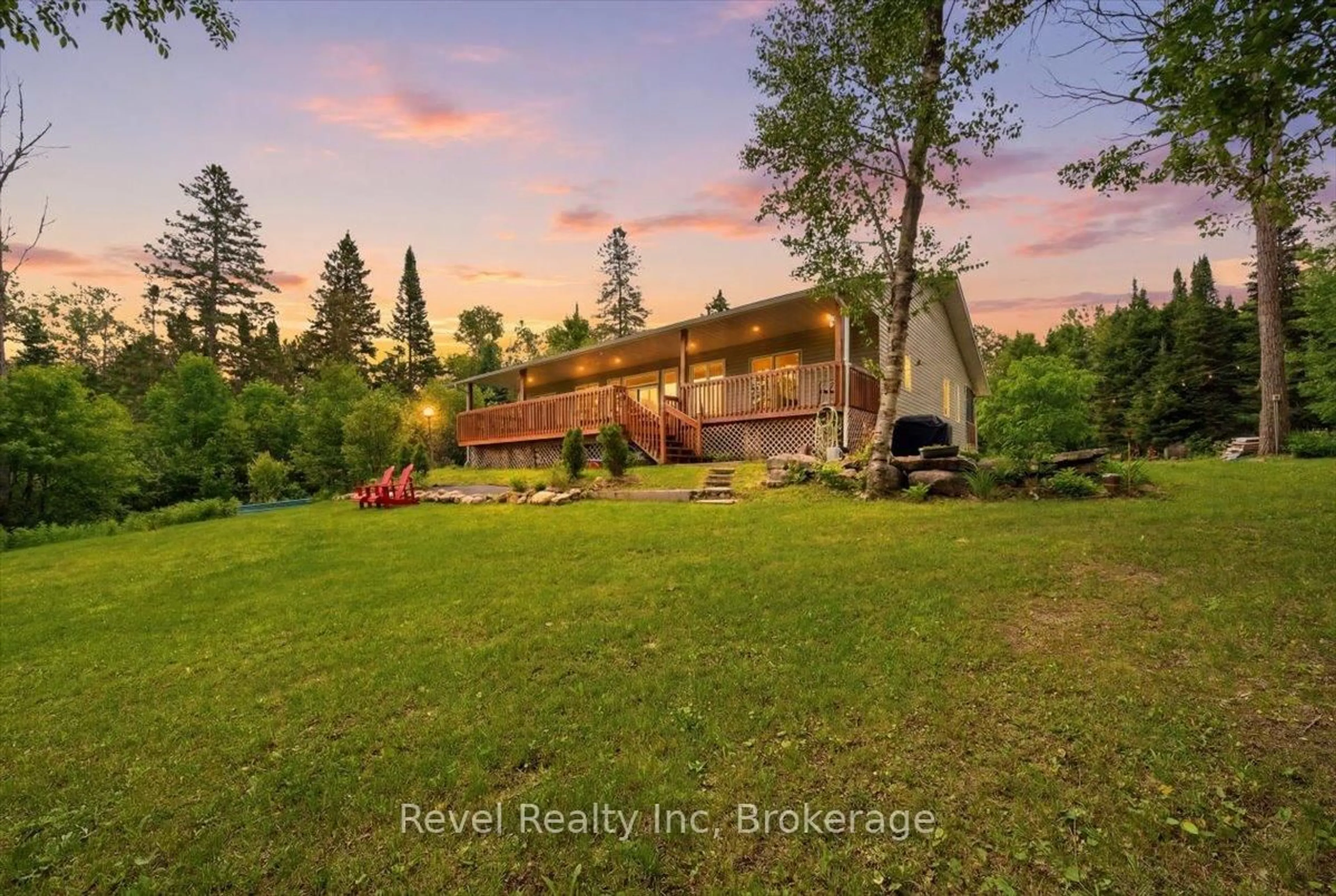 A pic from outside/outdoor area/front of a property/back of a property/a pic from drone, water/lake/river/ocean view for 1100 Morning Glory Dr, Highlands East Ontario K0M 1R0