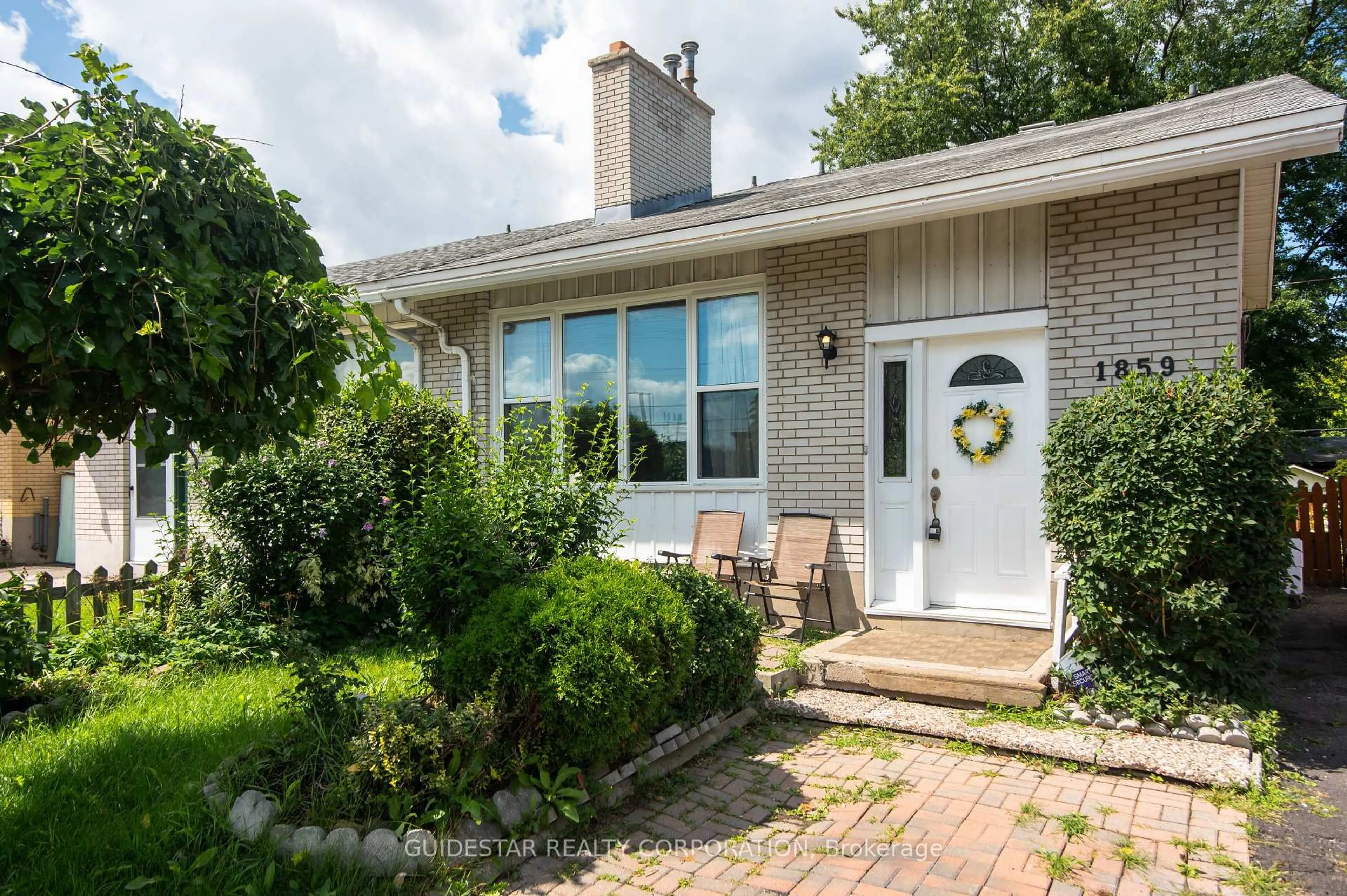 Home with brick exterior material, street for 1859 Walkley Rd, Ottawa Ontario K1H 6X9