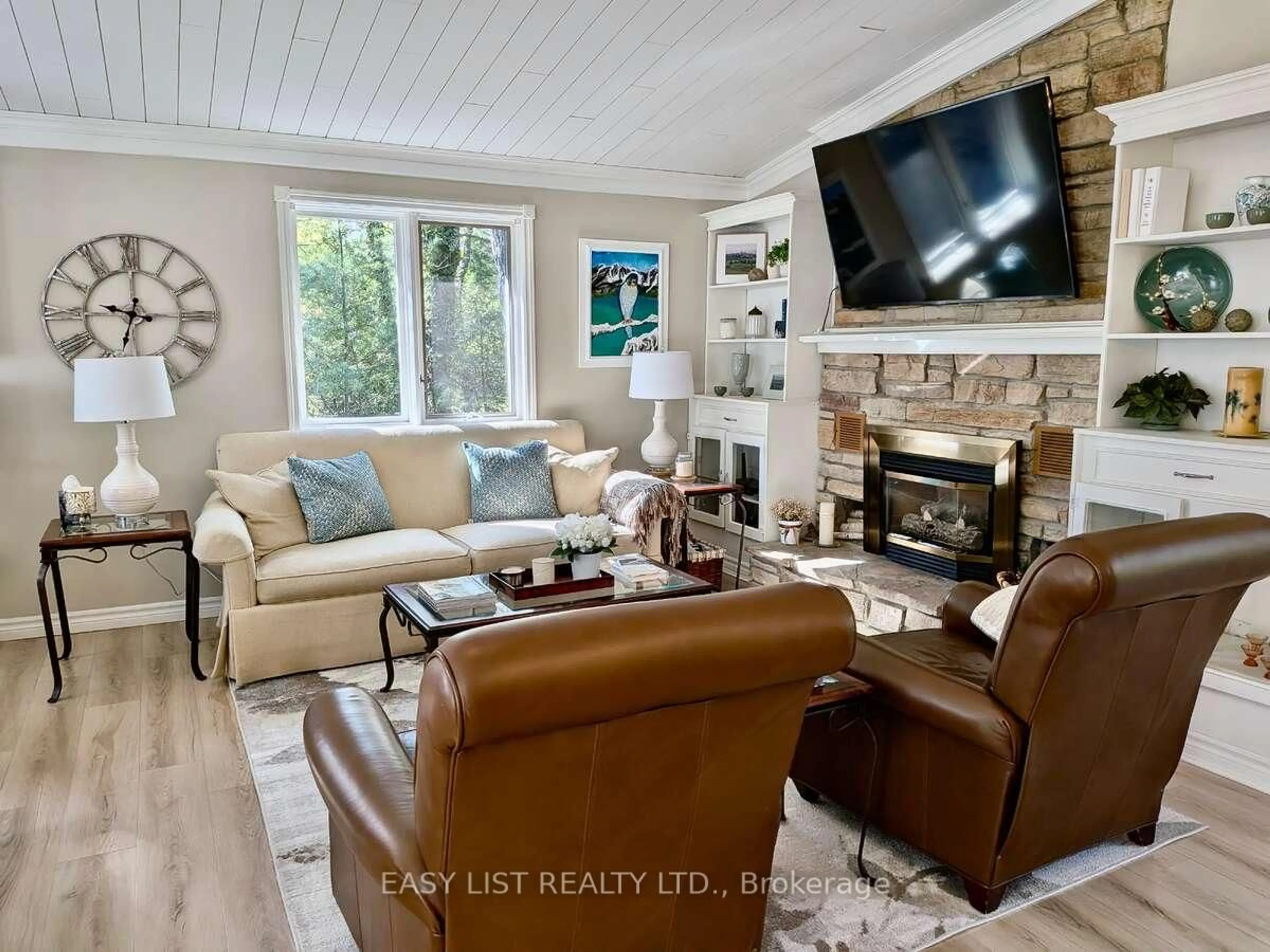 Living room with furniture, wood/laminate floor for 10161 Andrea St, Lambton Shores Ontario N0M 2L0
