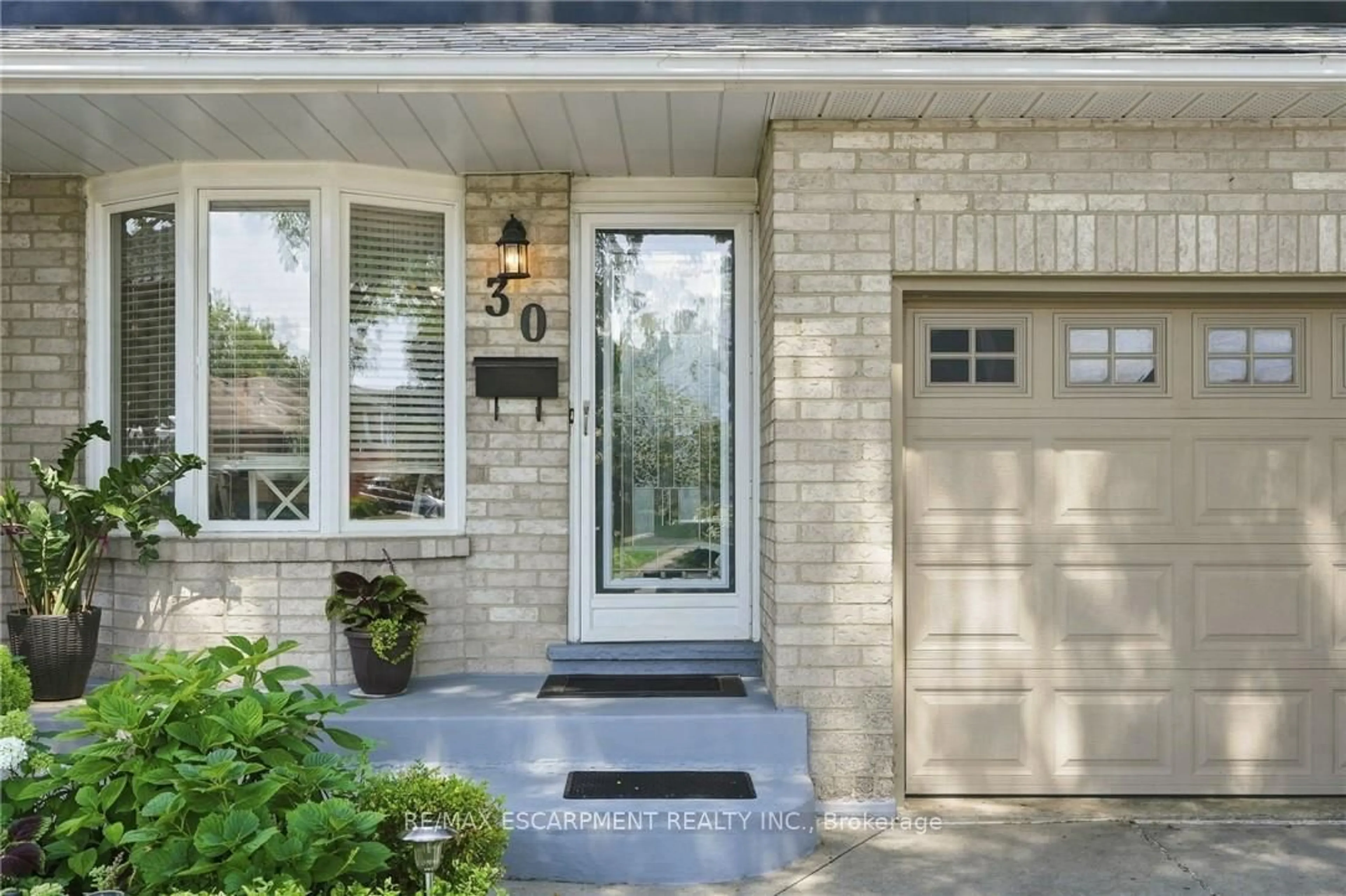 Home with brick exterior material, street for 30 Twinoaks Cres, Hamilton Ontario L8J 2E9