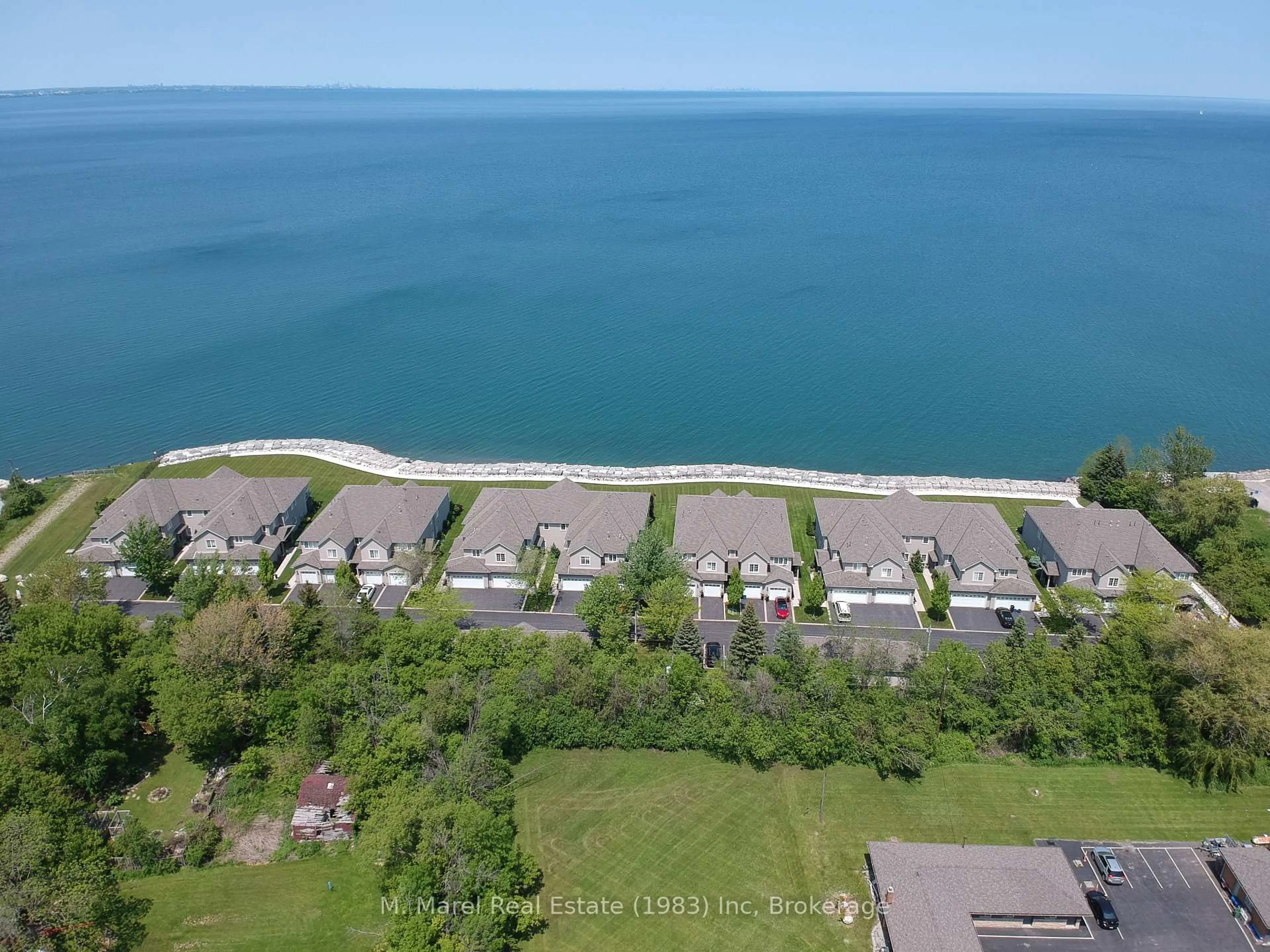 A pic from outside/outdoor area/front of a property/back of a property/a pic from drone, water/lake/river/ocean view for 484 Millen Rd #6, Hamilton Ontario L8E 6G4