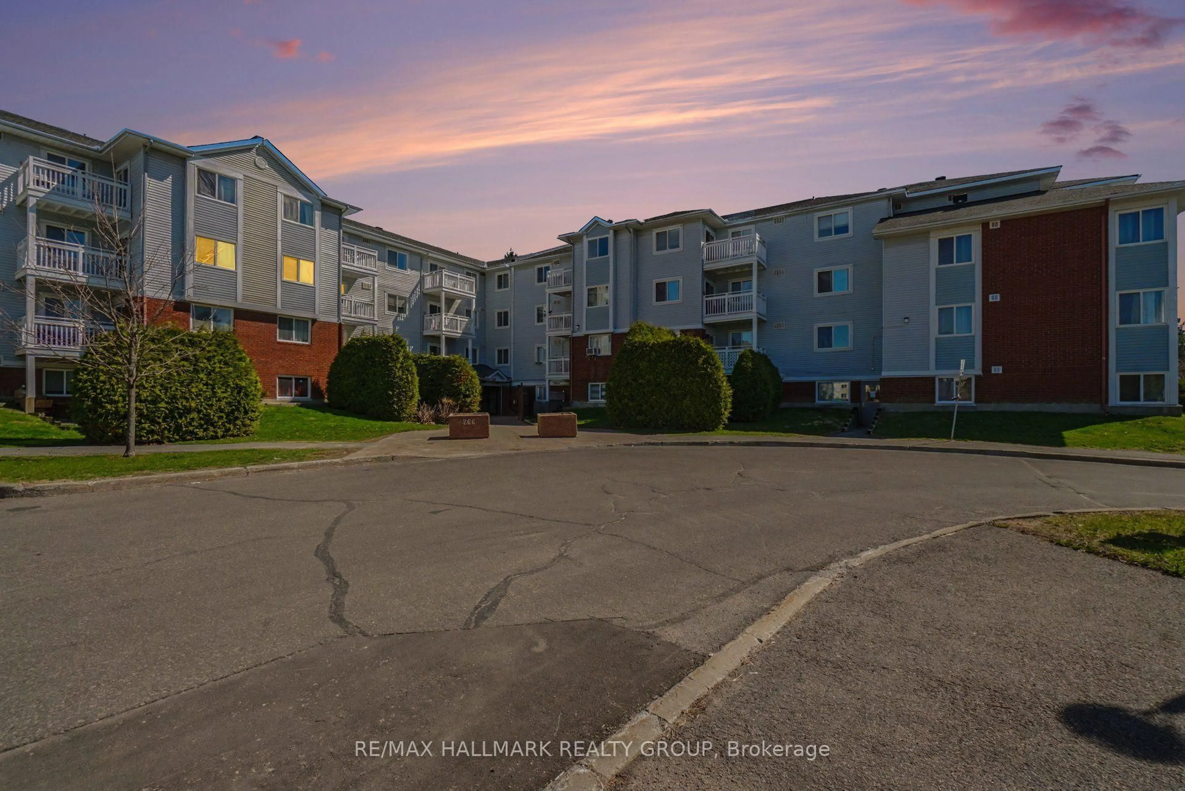 A pic from outside/outdoor area/front of a property/back of a property/a pic from drone, unknown for 266 Lorry Greenberg Dr #203, Ottawa Ontario K1T 3J9