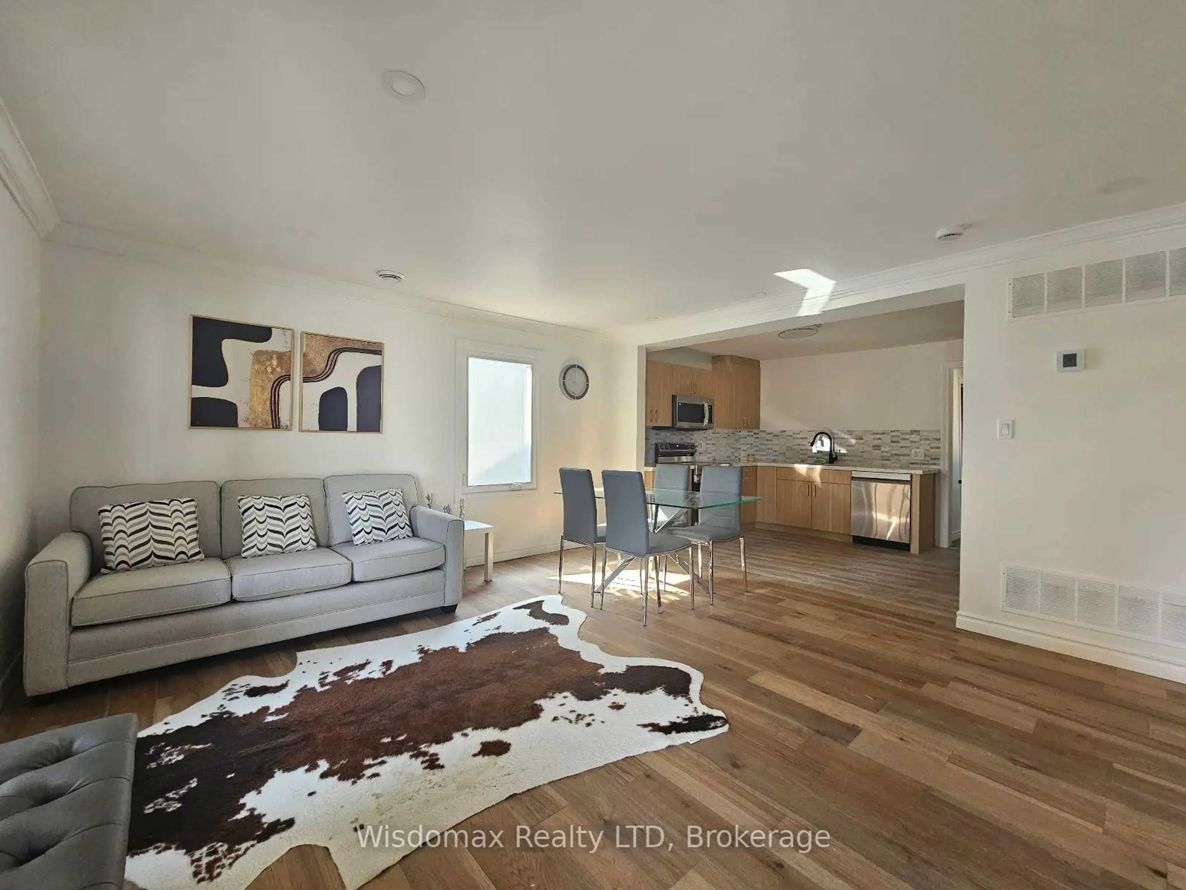 Living room with furniture, wood/laminate floor for 6245 CHURCHILL St, Niagara Falls Ontario L2G 2X5