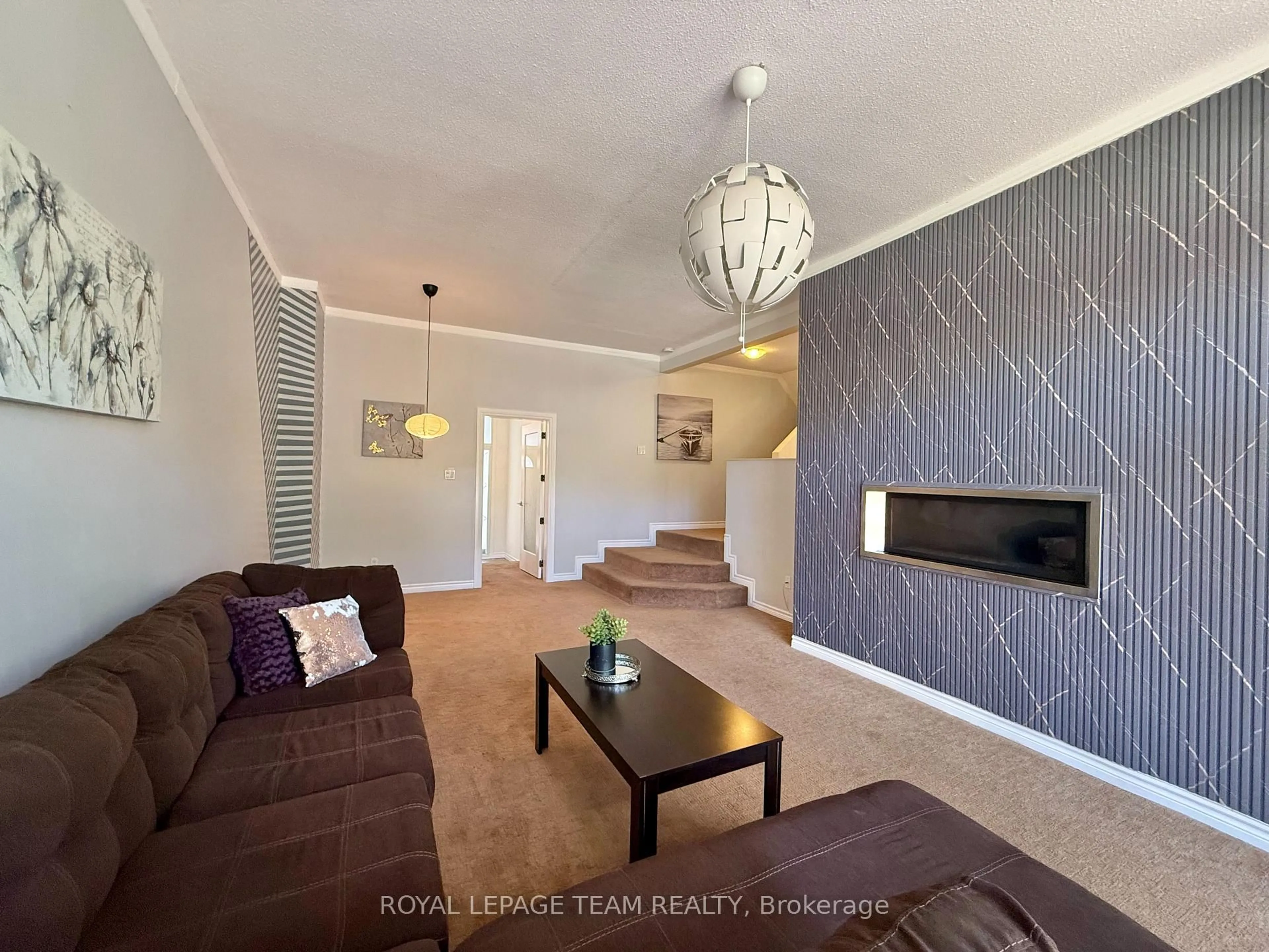 Living room with furniture, wood/laminate floor for 31 Rastila Cres, Ottawa Ontario K1T 2C5