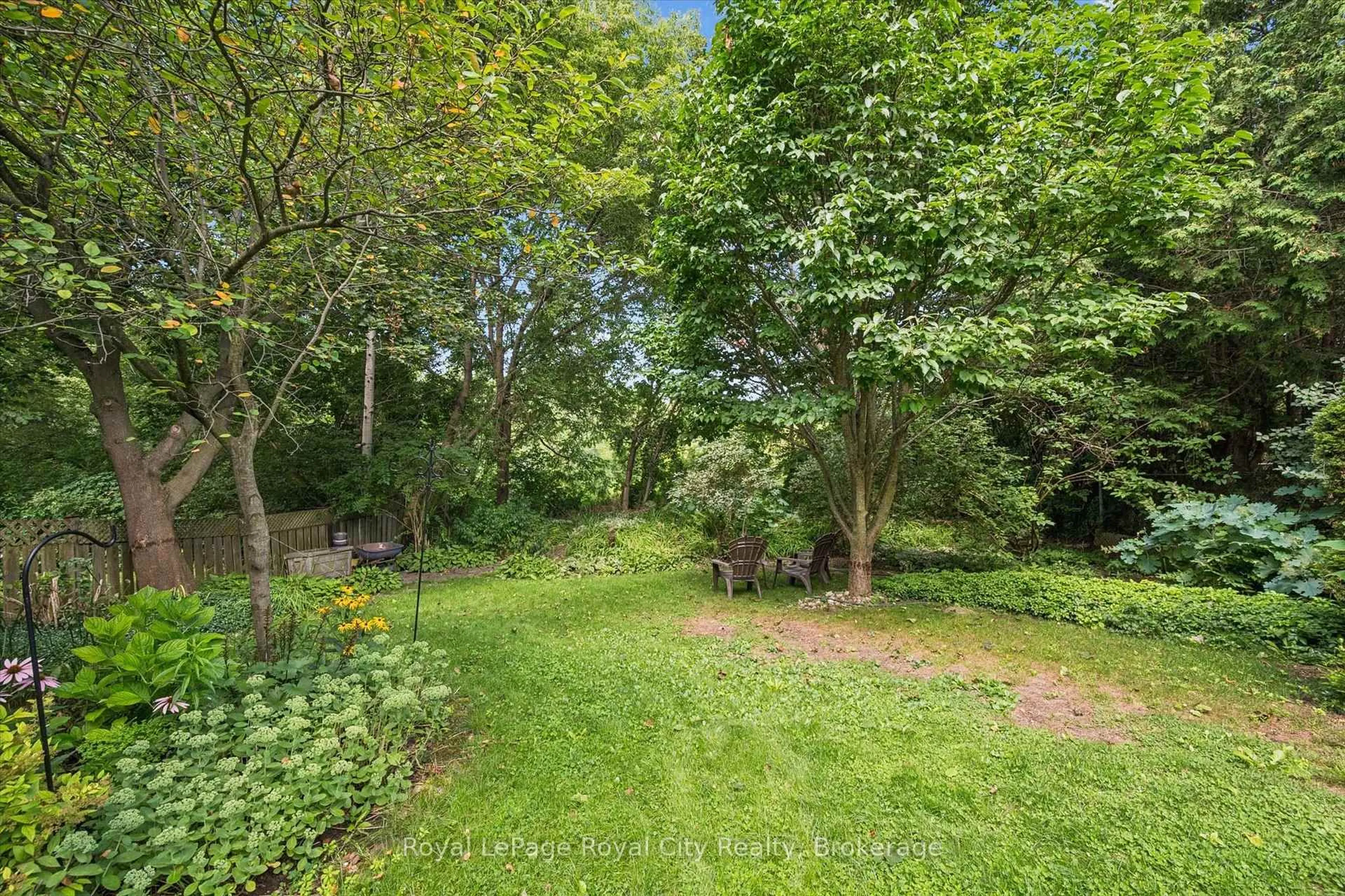 A pic from outside/outdoor area/front of a property/back of a property/a pic from drone, forest/trees view for 34 Pondview Cres, Guelph Ontario N1E 3K1