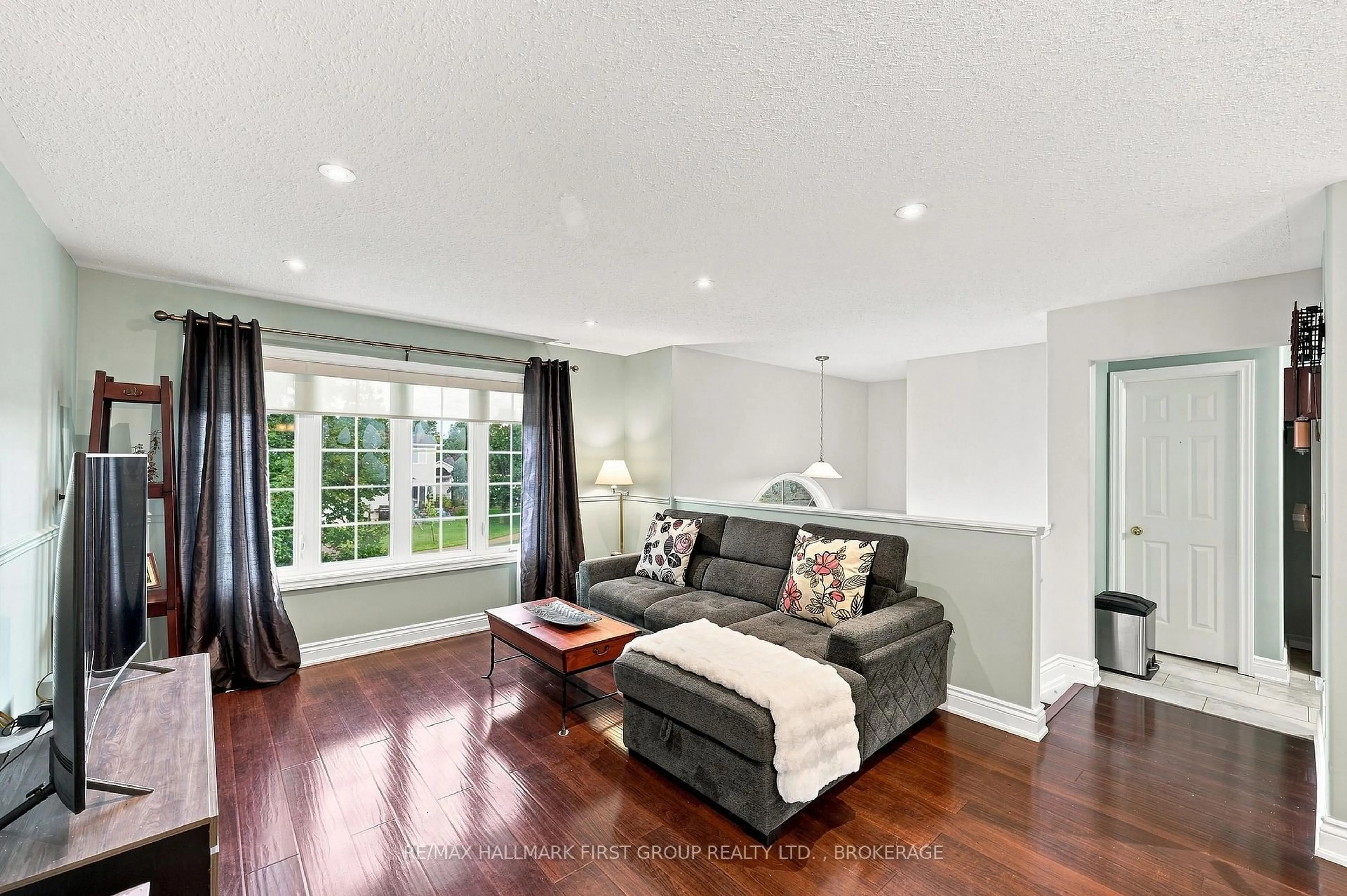 Living room with furniture, wood/laminate floor for 96 Briceland St, Kingston Ontario K7K 7L2