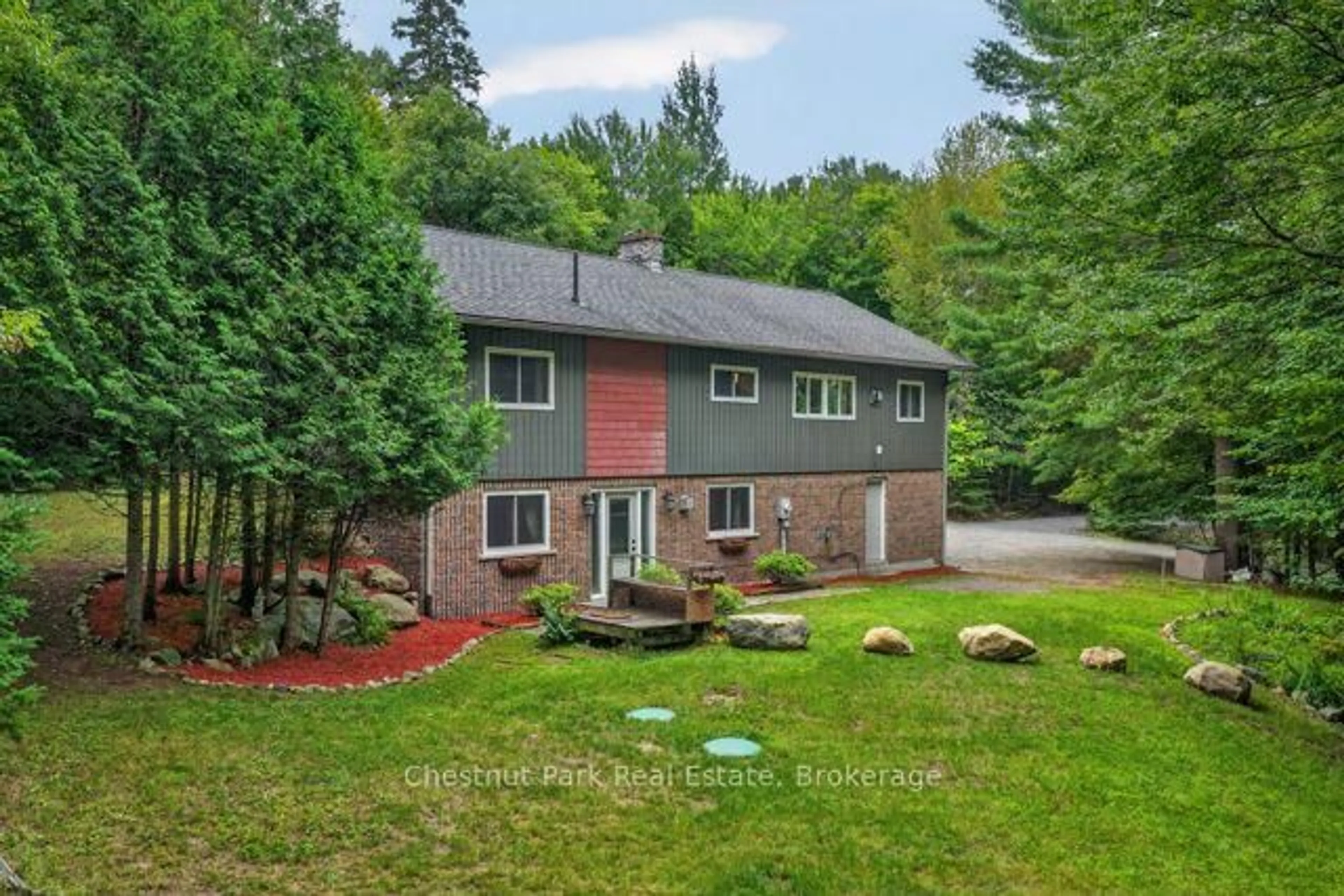 A pic from outside/outdoor area/front of a property/back of a property/a pic from drone, forest/trees view for 1039 South Waseosa Lake Rd, Huntsville Ontario P1H 2N5