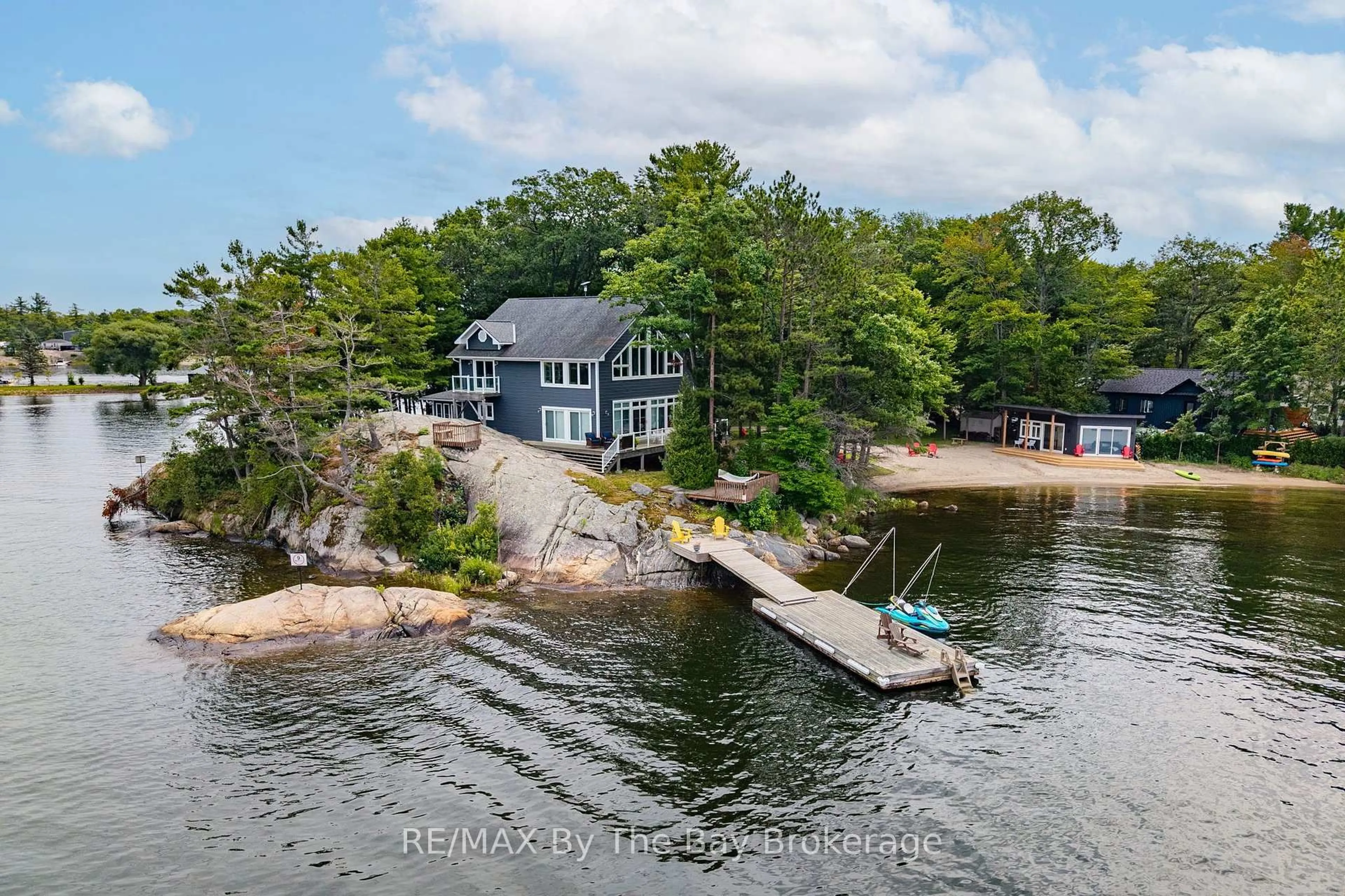A pic from outside/outdoor area/front of a property/back of a property/a pic from drone, water/lake/river/ocean view for 31 Gidley Tpke, Georgian Bay Ontario P0E 1E0