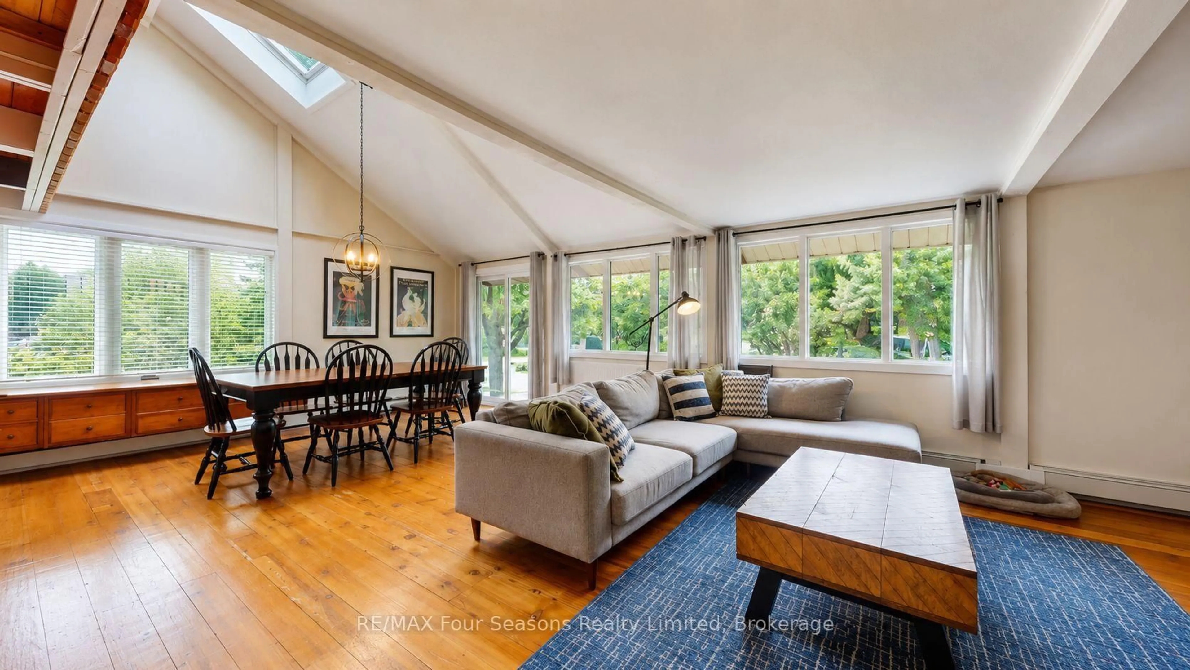 Living room with furniture, wood/laminate floor for 163 Craigleith Rd, Blue Mountains Ontario L9Y 0S4