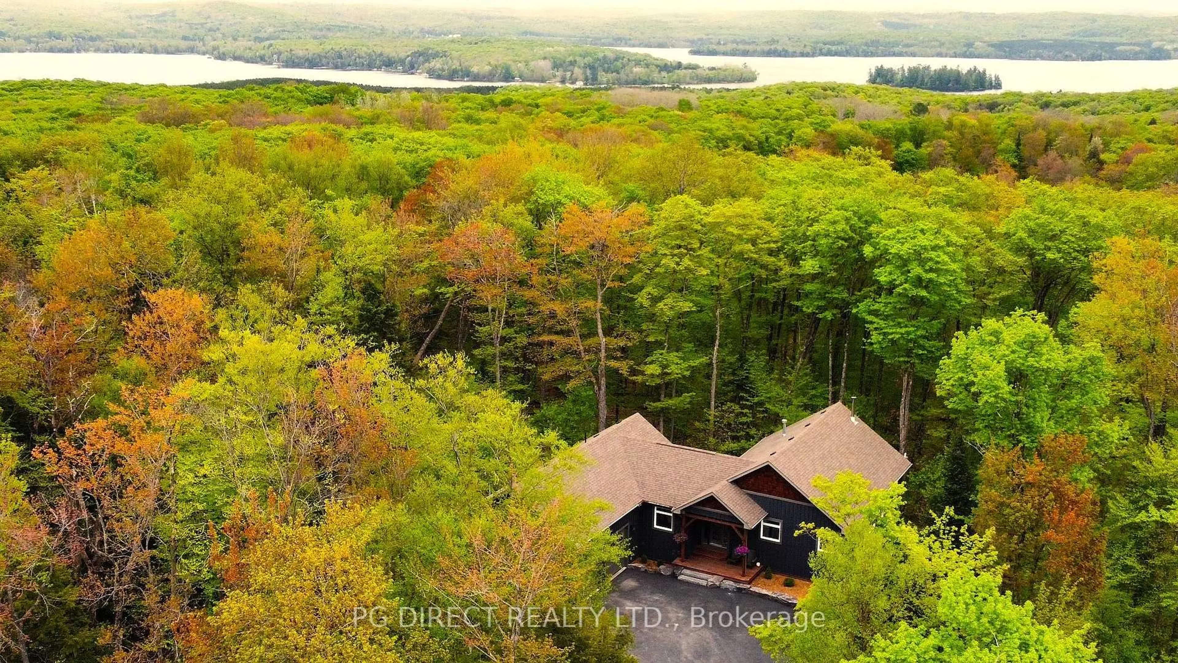 A pic from outside/outdoor area/front of a property/back of a property/a pic from drone, water/lake/river/ocean view for 2 Hawk Ridge Crt, Huntsville Ontario P1H 0A7