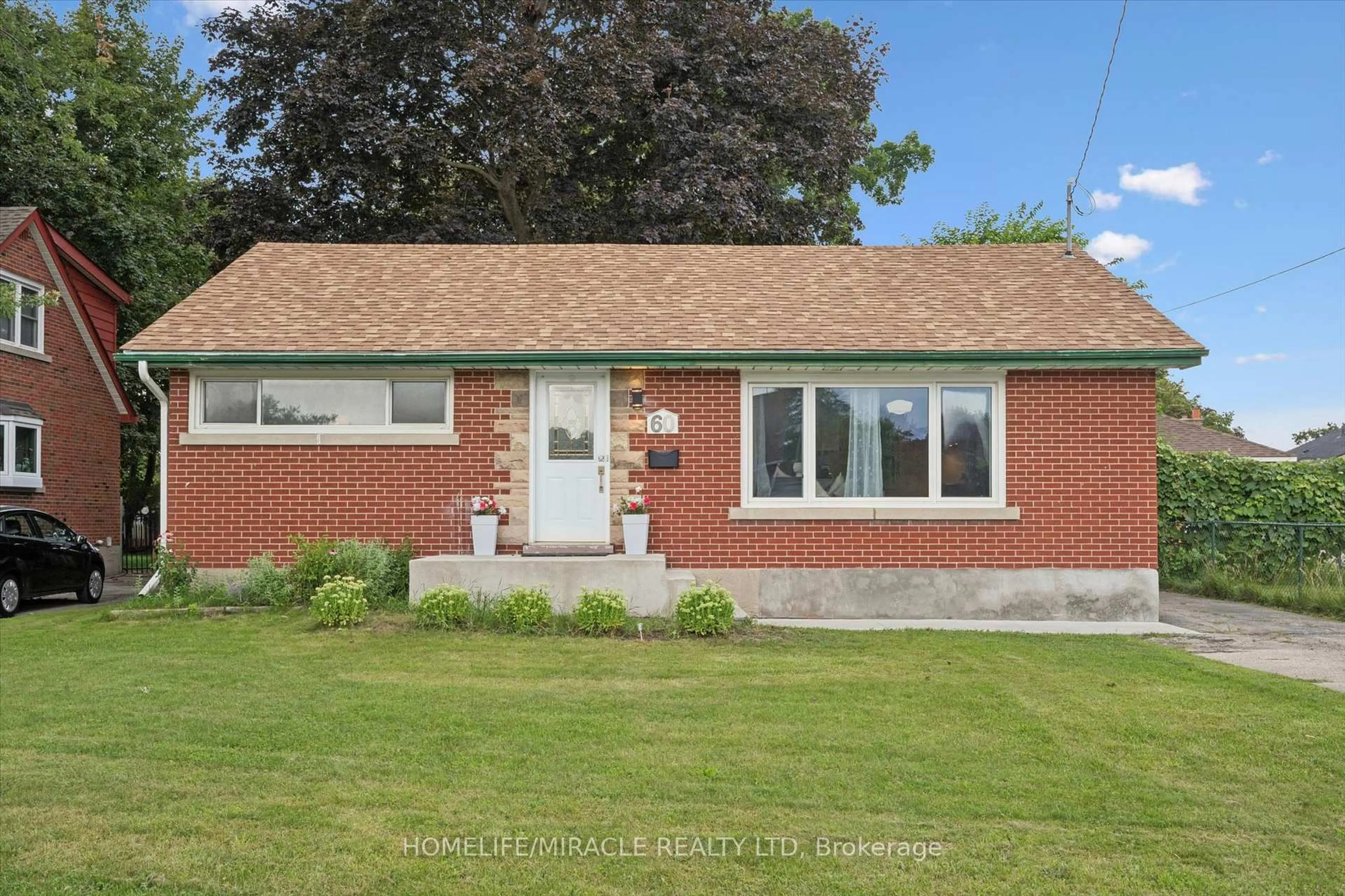 Home with brick exterior material, street for 60 Edinburgh Rd, Kitchener Ontario N2B 1M5