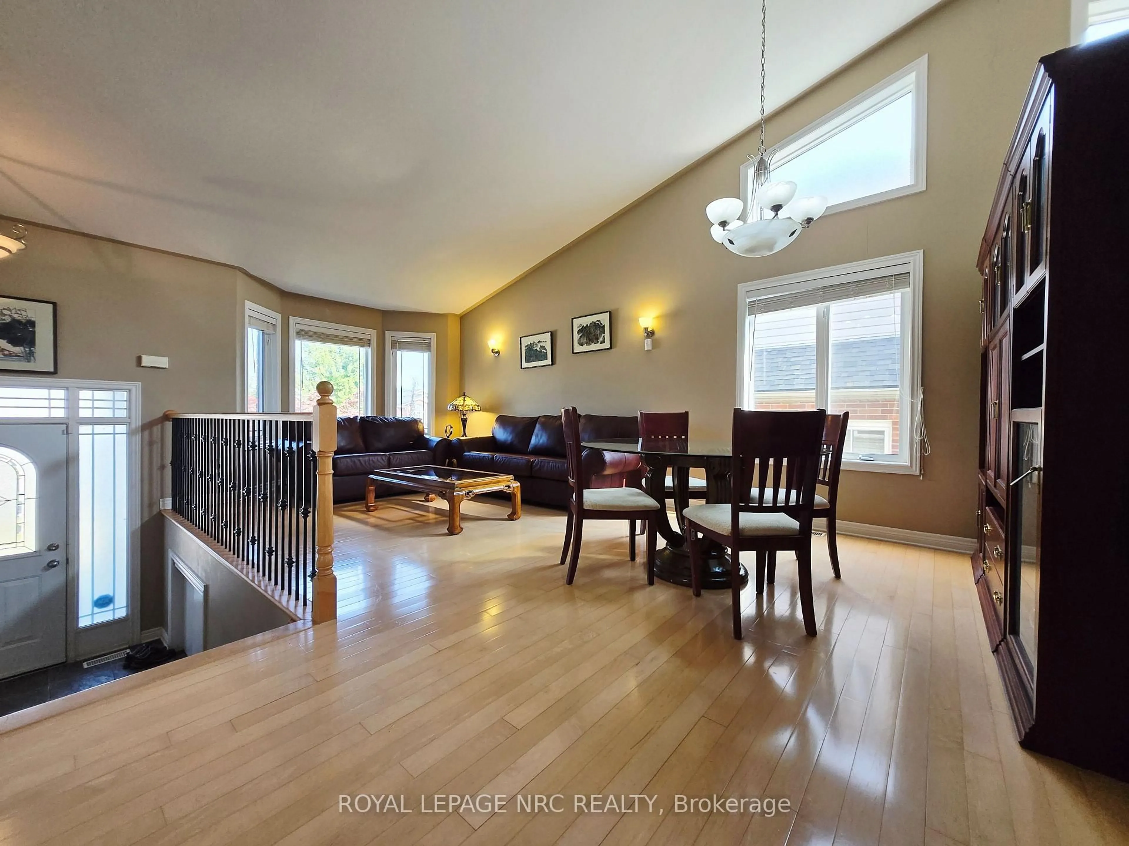 Living room with furniture, wood/laminate floor for 7139 Parkside Rd, Niagara Falls Ontario L2H 3L6
