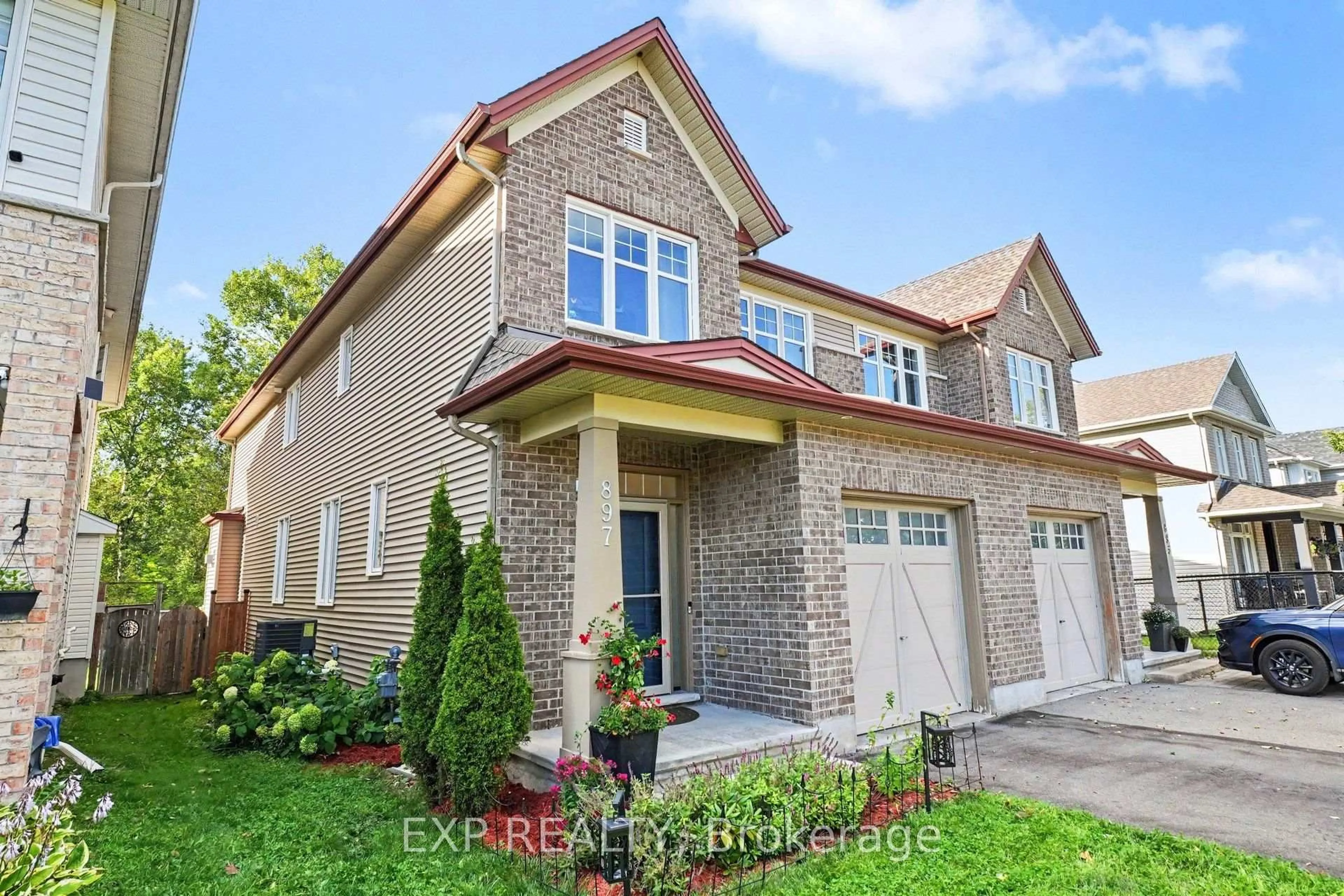 Home with brick exterior material, street for 897 Bunchberry Way, Ottawa Ontario K1T 3T8