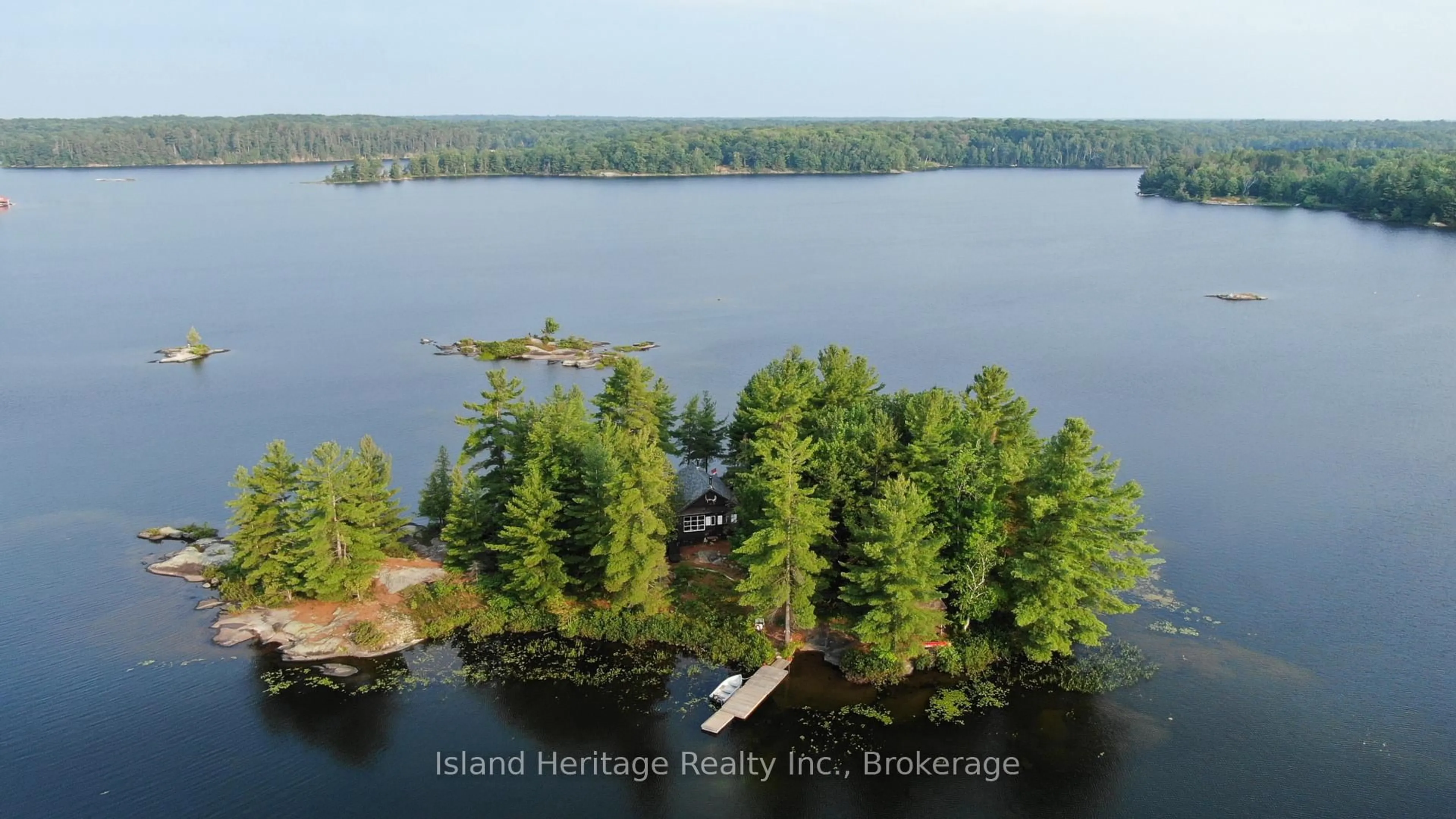 A pic from outside/outdoor area/front of a property/back of a property/a pic from drone, water/lake/river/ocean view for 2 trout lake Island, McDougall Ontario P2A 2Z1
