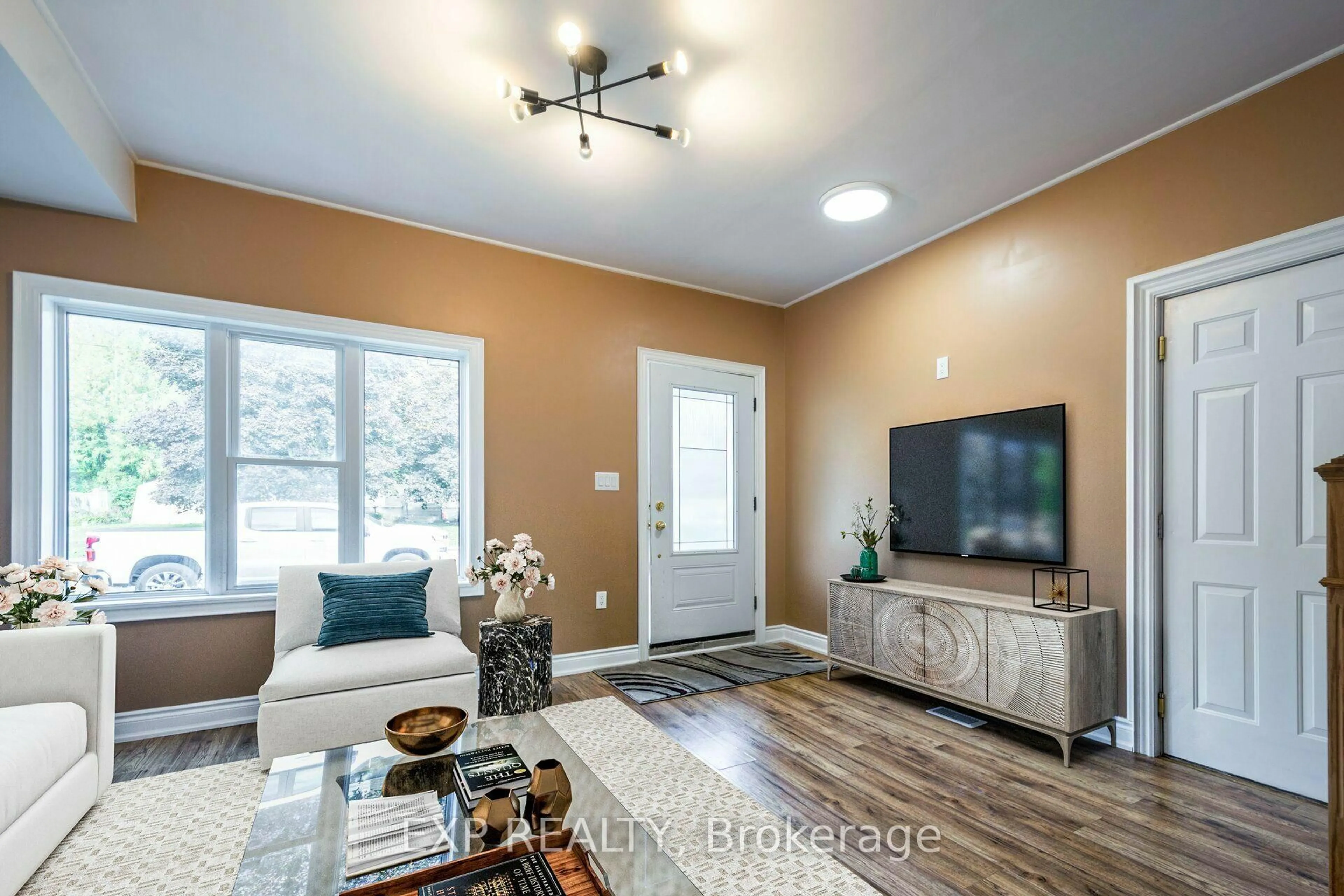Living room with furniture, wood/laminate floor for 59 Kent St, Trent Hills Ontario K0L 1L0