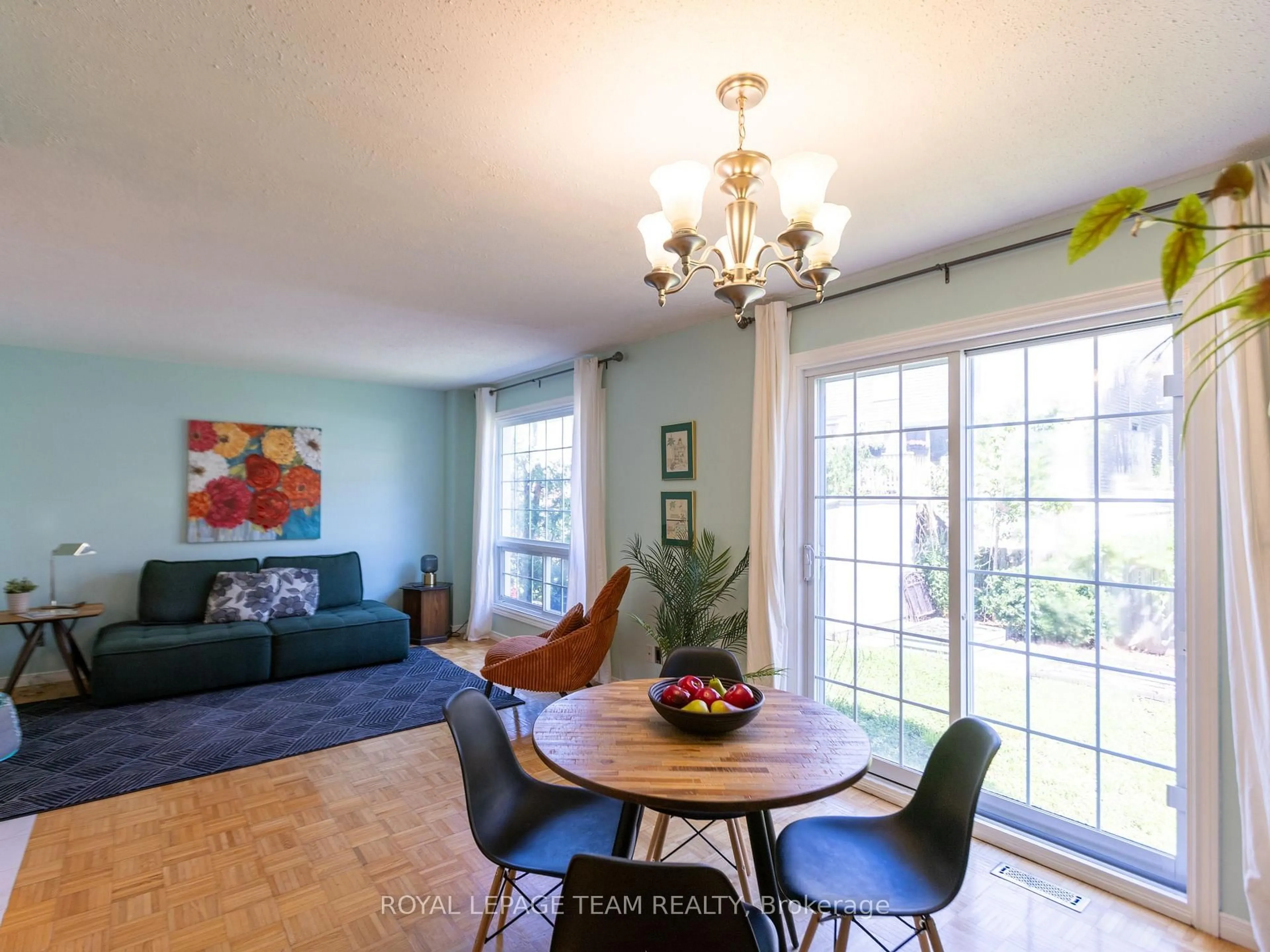 Living room with furniture, wood/laminate floor for 930 Alenmede Cres, Ottawa Ontario K2B 8K5