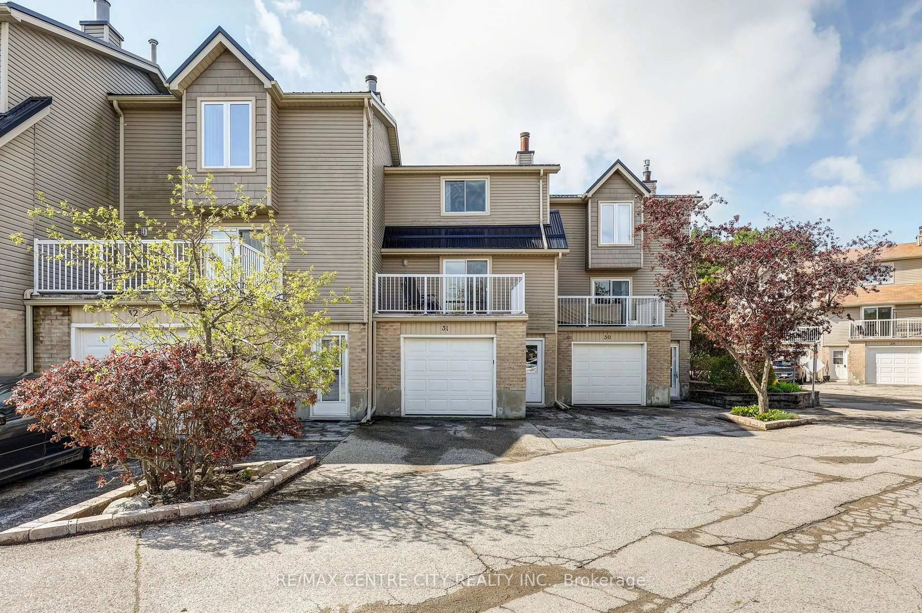 A pic from outside/outdoor area/front of a property/back of a property/a pic from drone, street for 301 Carlow Rd #31, Central Elgin Ontario N5L 1B7