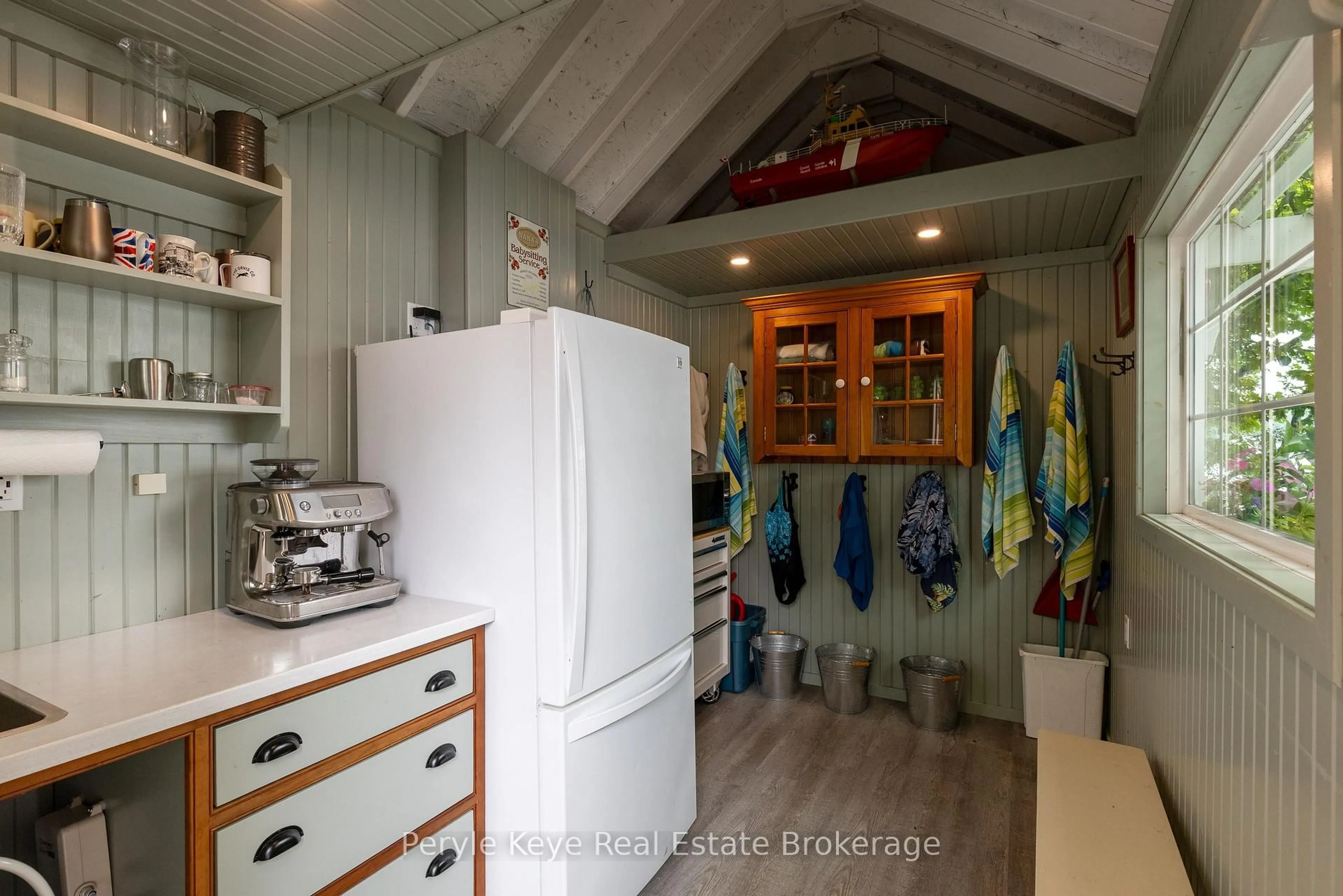Kitchen with laundary machines, ceramic/tile floor for 1159 Maplehurst Dr, Lake of Bays Ontario P1H 2J6