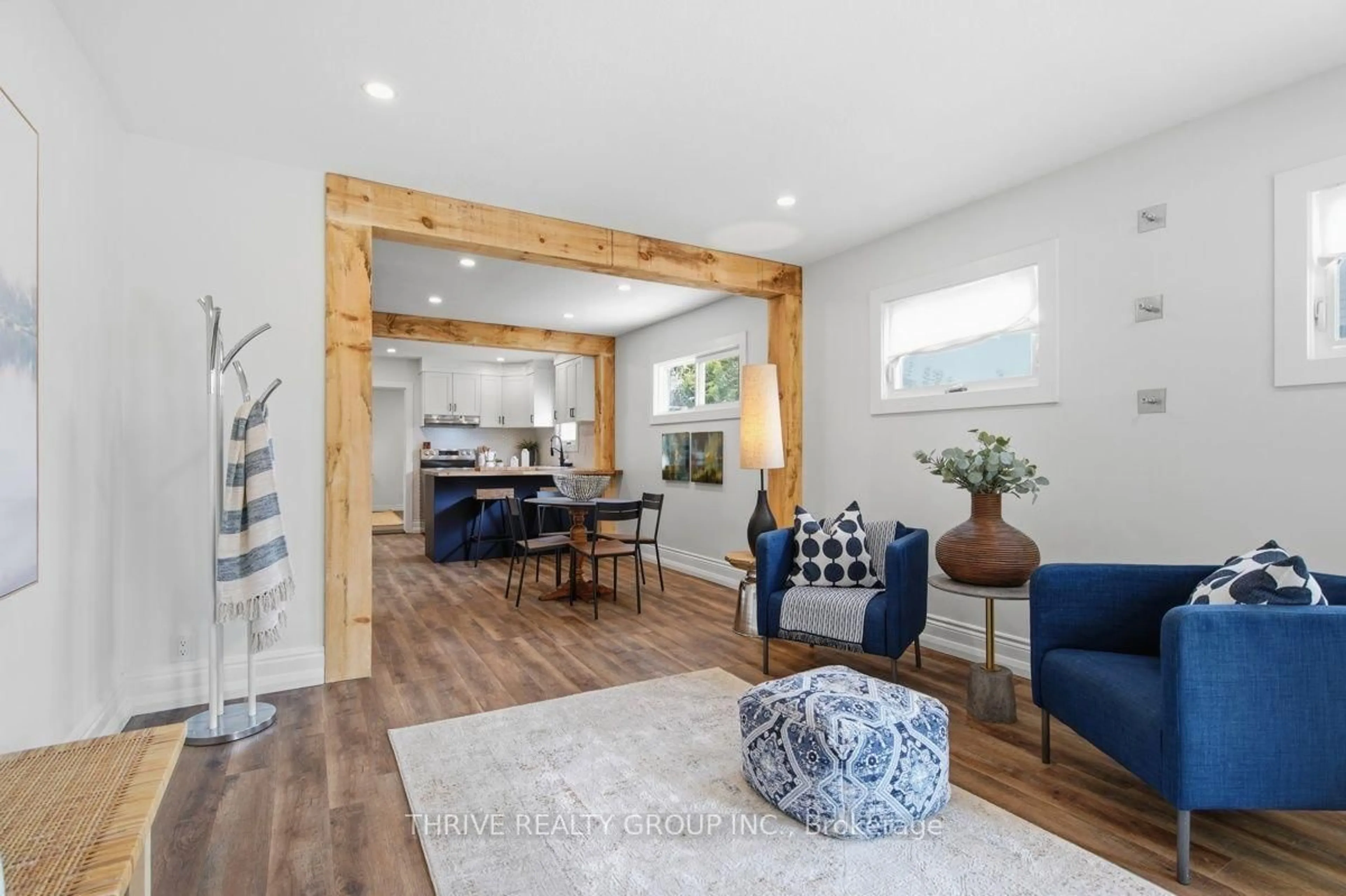 Living room with furniture, wood/laminate floor for 35 Malakoff St, St. Thomas Ontario N5P 1L8