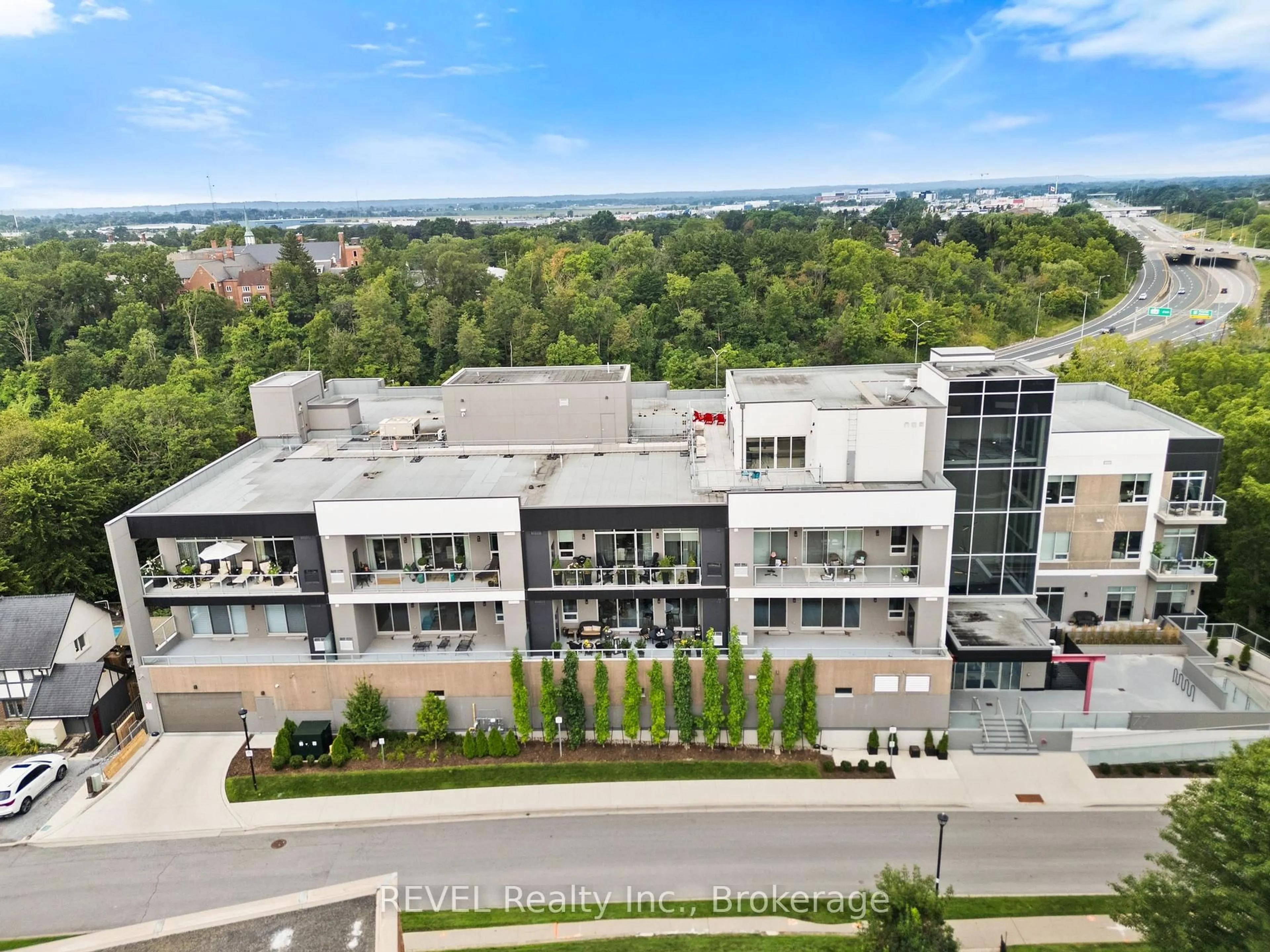 A pic from outside/outdoor area/front of a property/back of a property/a pic from drone, city buildings view from balcony for 77 YATES St #404, St. Catharines Ontario L2R 0C4