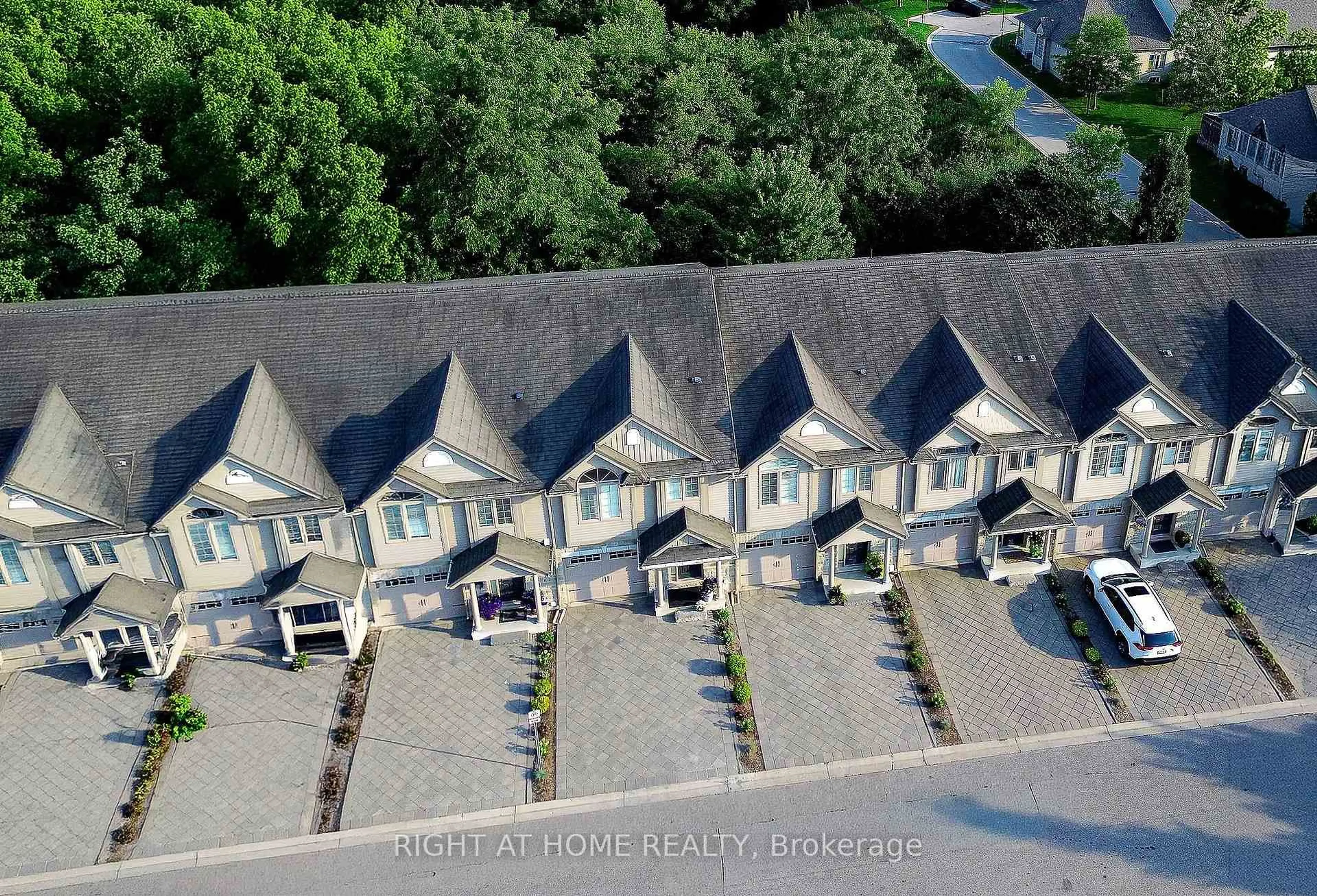 A pic from outside/outdoor area/front of a property/back of a property/a pic from drone, unknown for 582 Hyde Park Rd #7, London North Ontario N6H 3S1